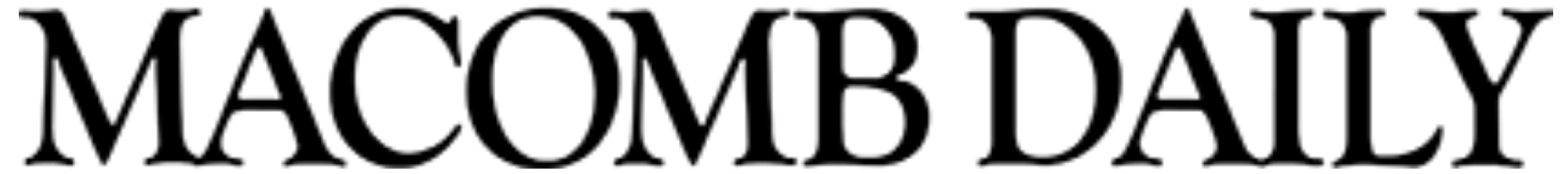 The logo of Macomb Daily, a newspaper, displayed in black text on a white background.