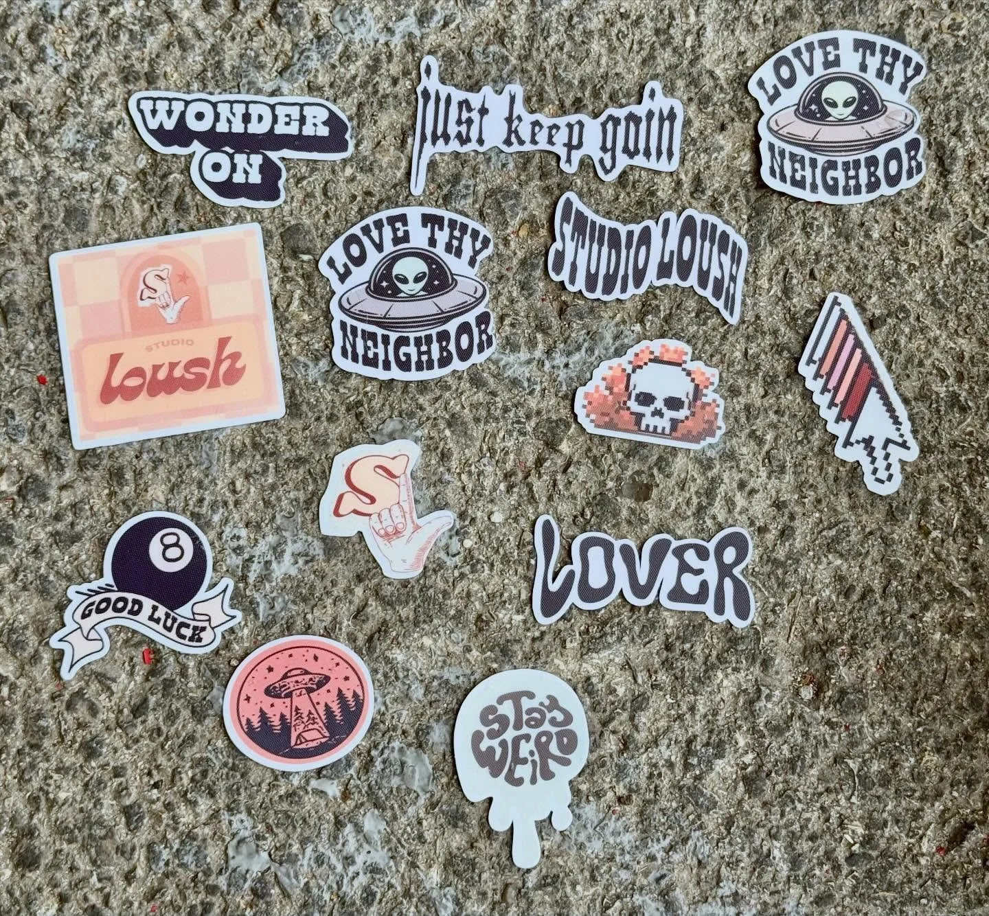new stickers dropped today!!!! (in my shop but also literally onto the ground for these pics 📷) thank you all for the support and love, studio loush is just getting started 🫶🏼👽✨