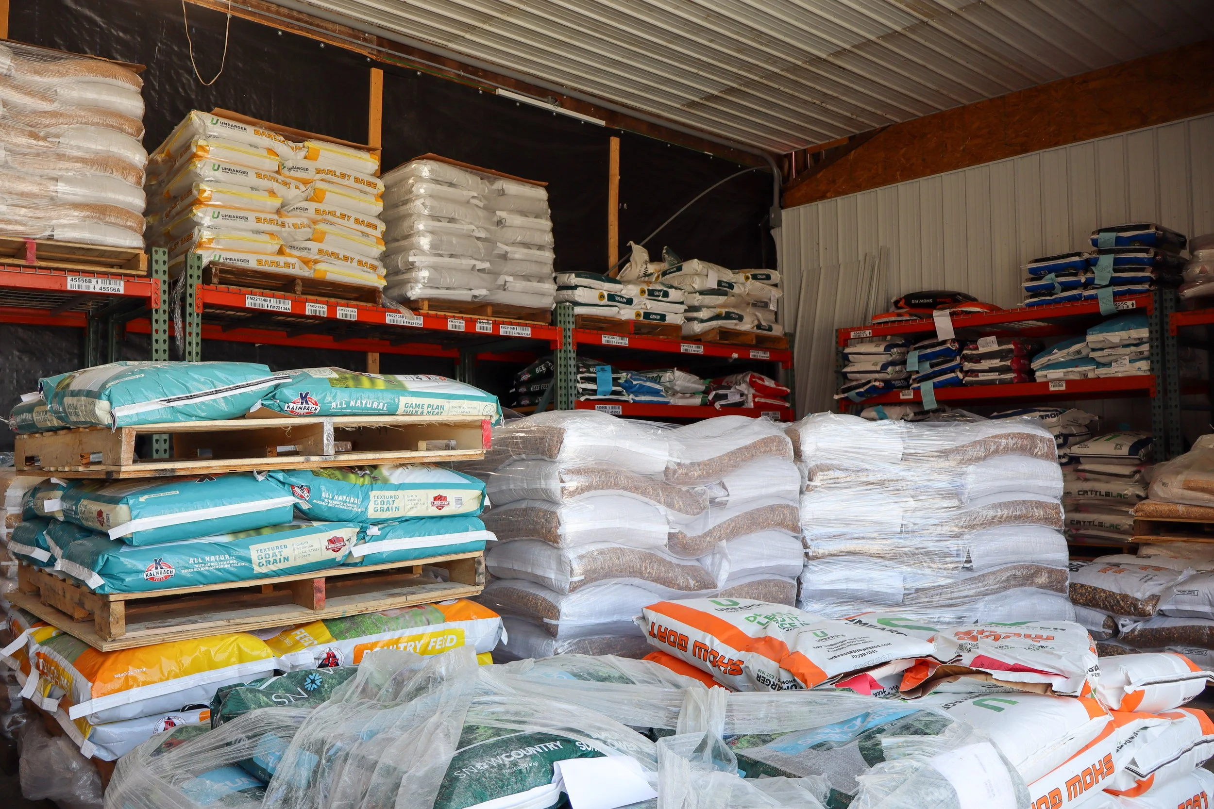 shelves full of animal food and supplements