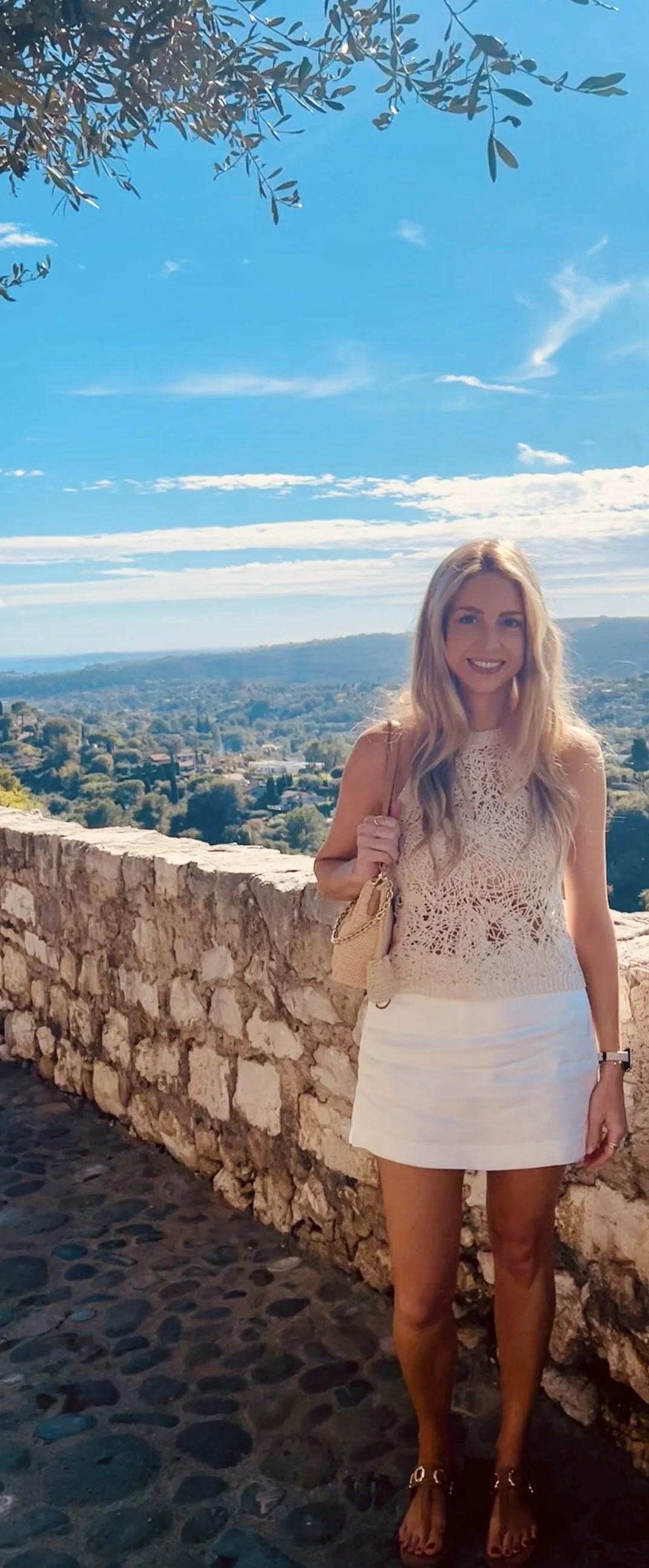 Traveler overlooking the countryside from Saint-Paul-de-Vence in southern France.