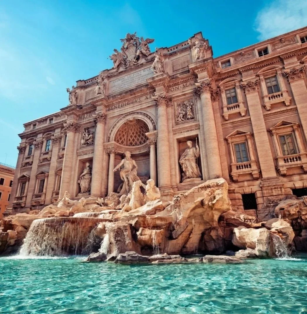 Trevi Fountain in Rome, Italy, surrounded by historic Baroque architecture.