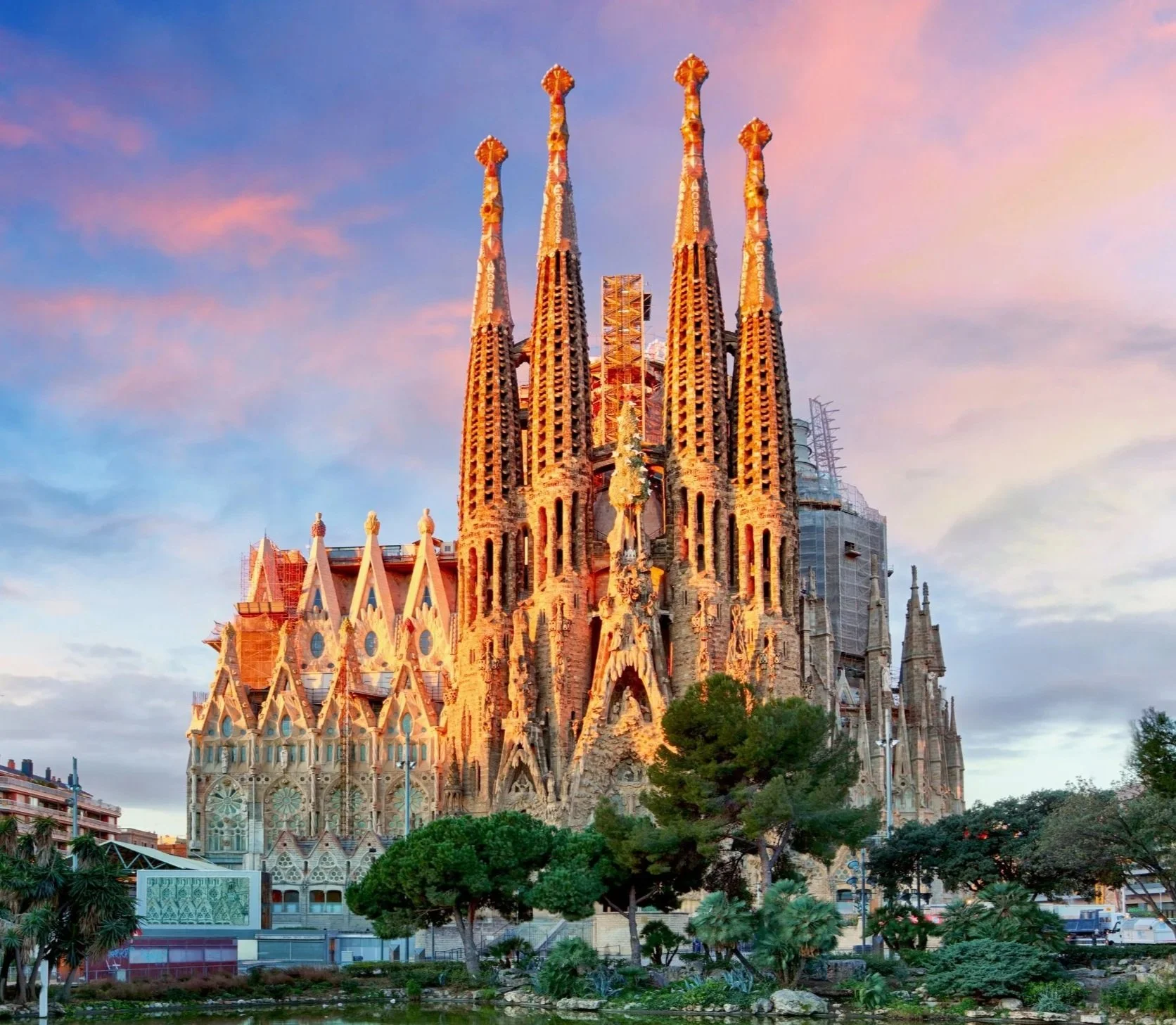 Sagrada Família in Barcelona, Spain, illuminated by warm evening light.