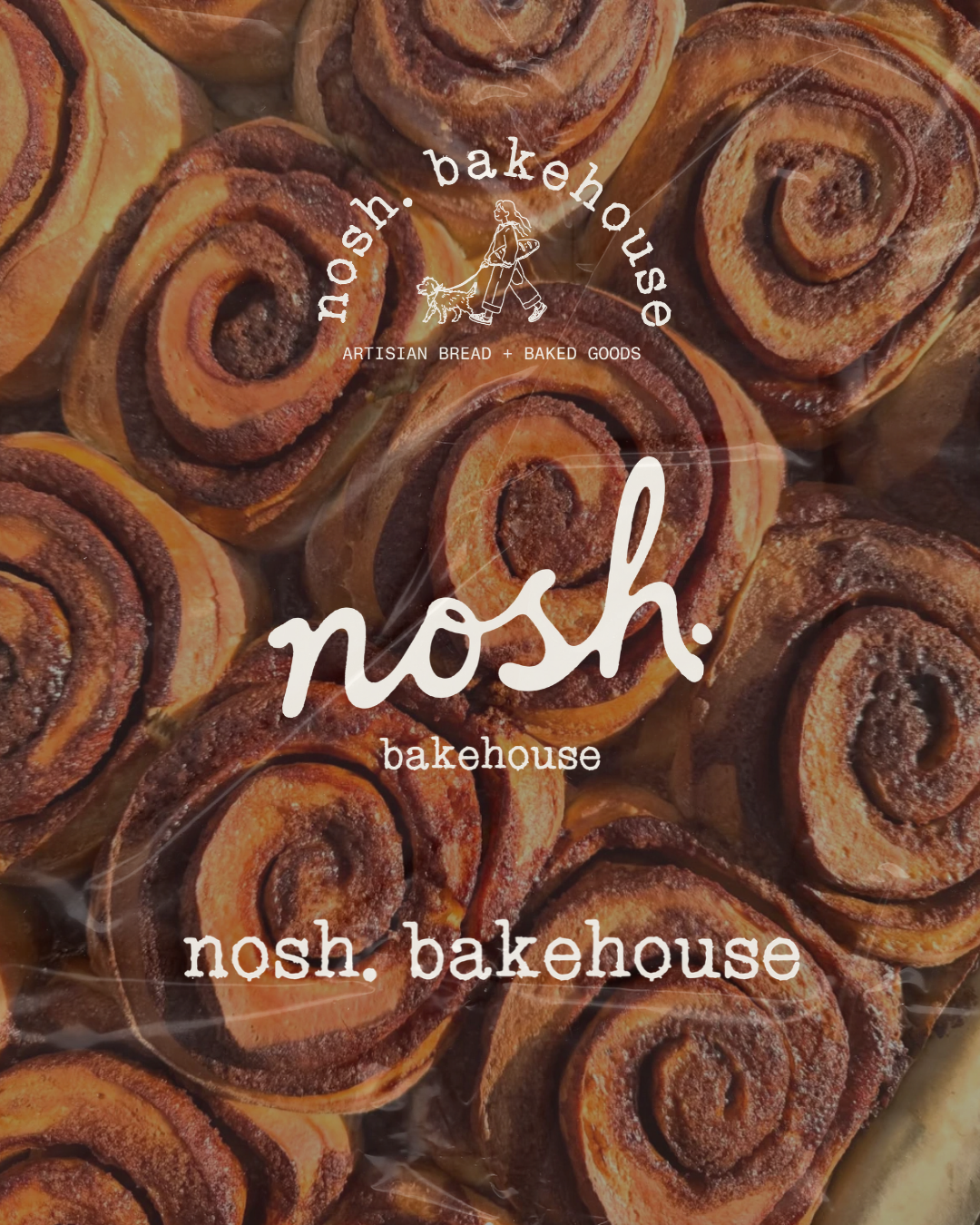 Close-up of cinnamon rolls with swirled layers of dough and cinnamon filling, topped with sugar. The image features a bakery logo and text overlay for Nosh Bakehouse.