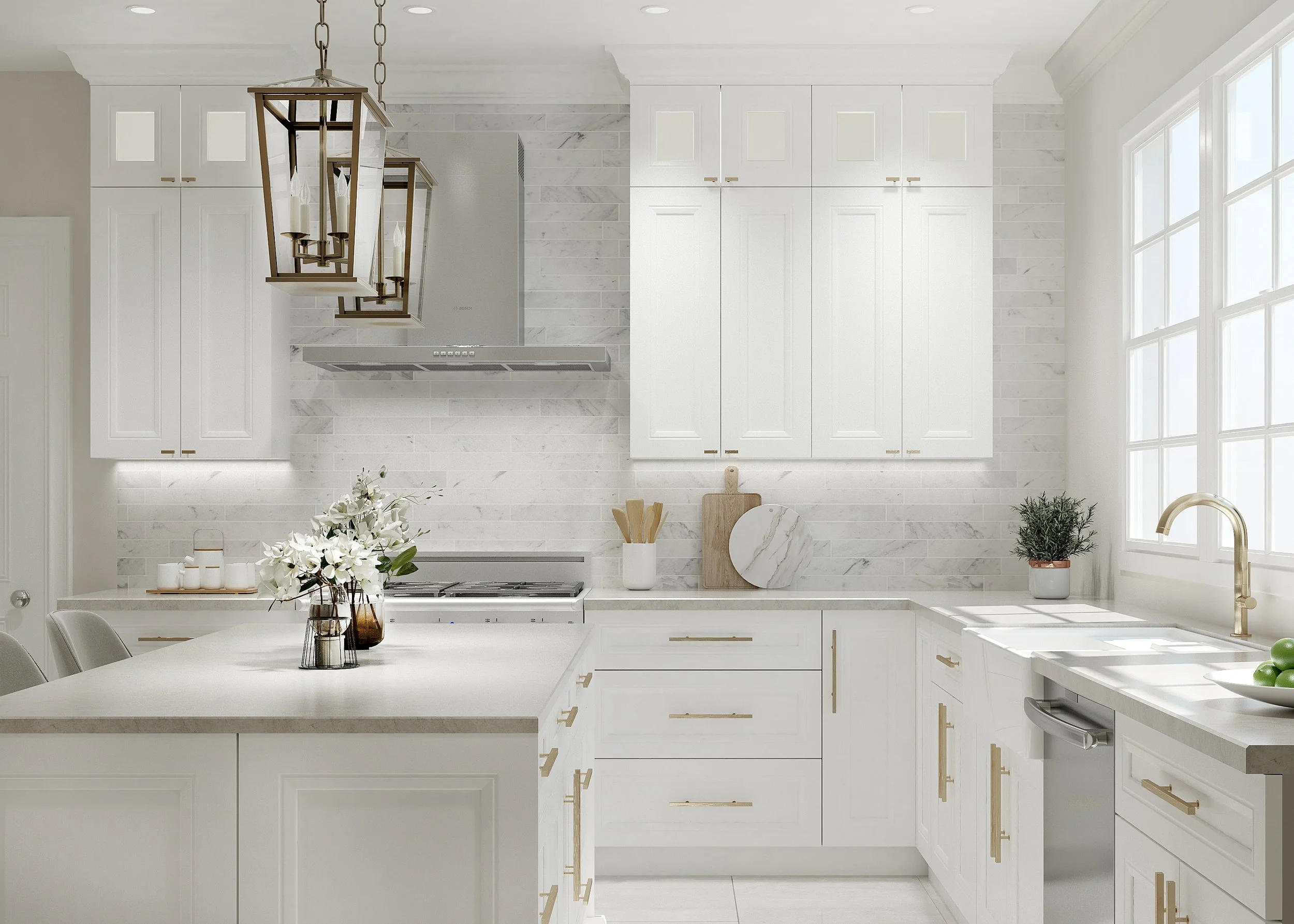 A bright, modern white kitchen with white cabinets, marble backsplash, and a white countertop. A gold-finished chandelier hangs above the island, which has a vase with white flowers and a tray with cups. Large windows on the right let in natural light, and a plant sits near the sink.