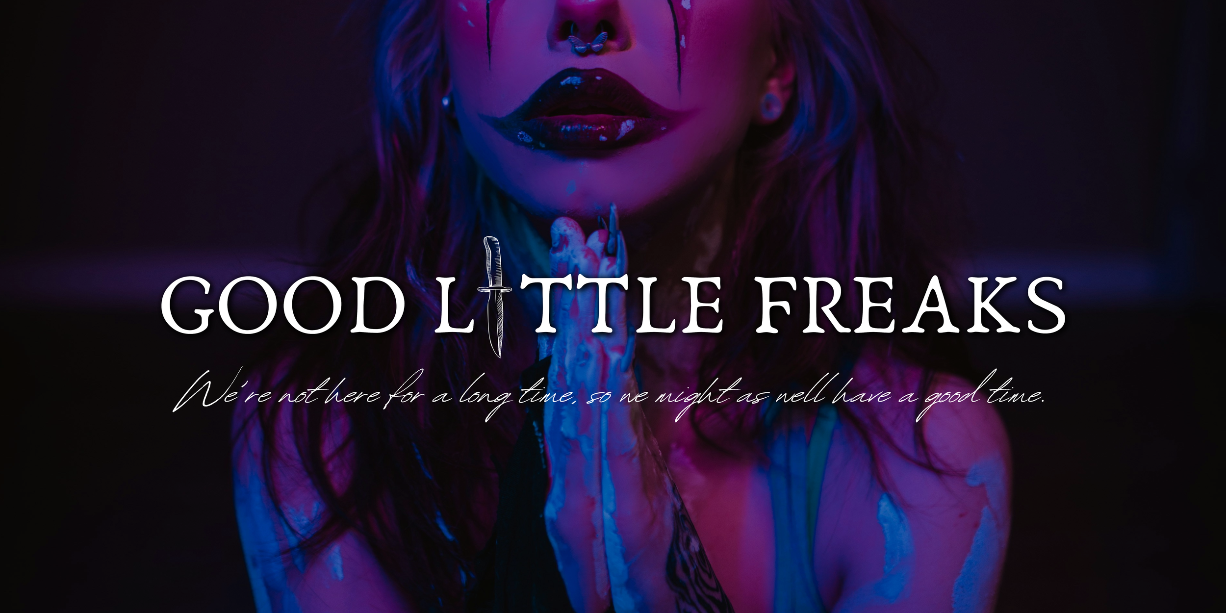 A dimmed photo of a femme-person in clown makeup and hands folded in prayer and the following text: Good Little Freaks. "We're not here for a long time, so we might as well have a good time."