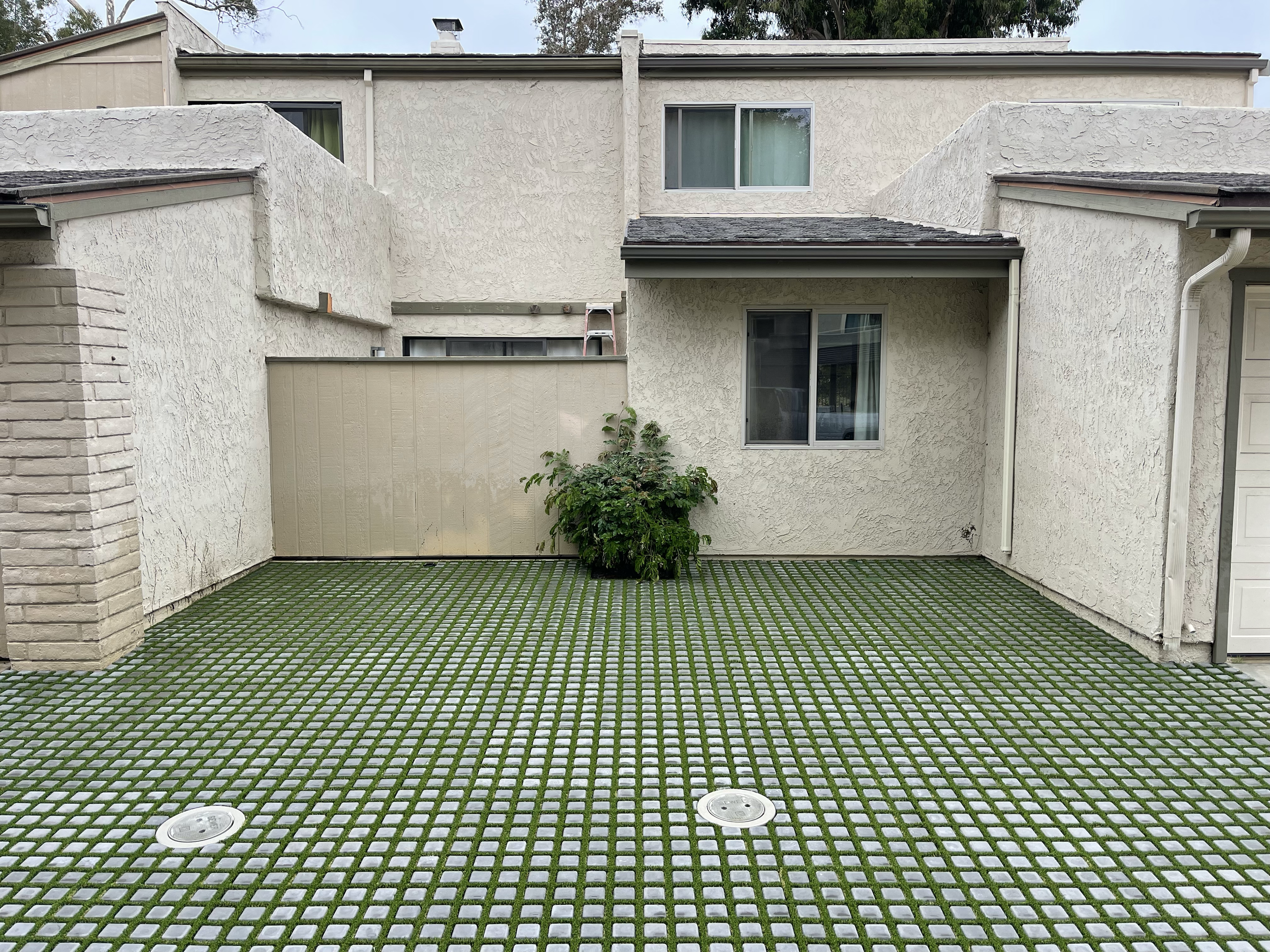HOA-approved drivable grass installation designed to provide additional parking while preserving a functional, green outdoor space.