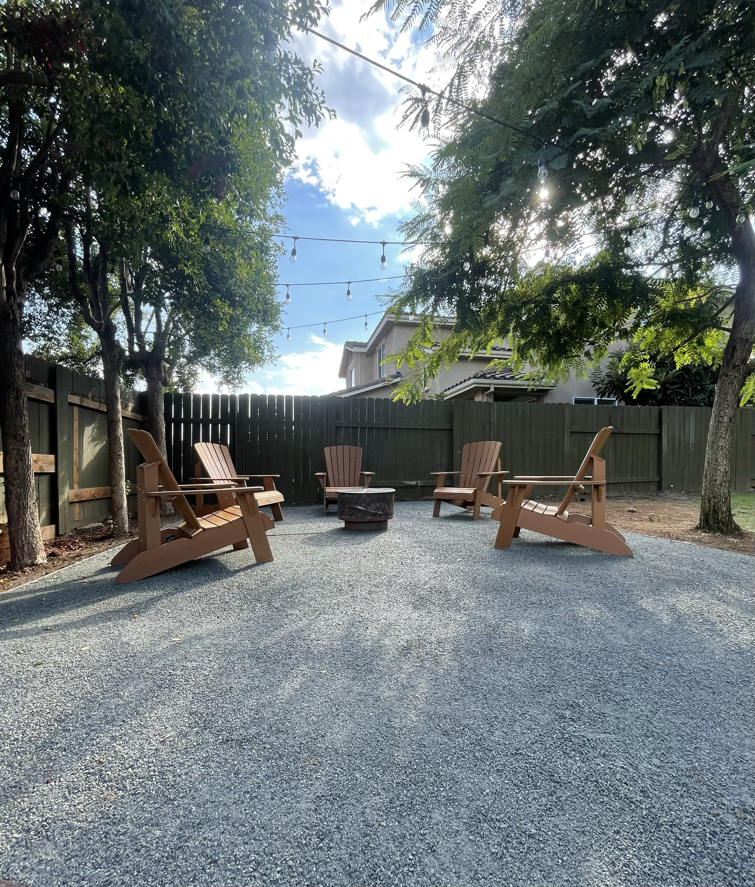 Bender board and Decomposed Granite installation creating a clean, low maintenance fire pit seating area designed for relaxing and gathering outdoors.