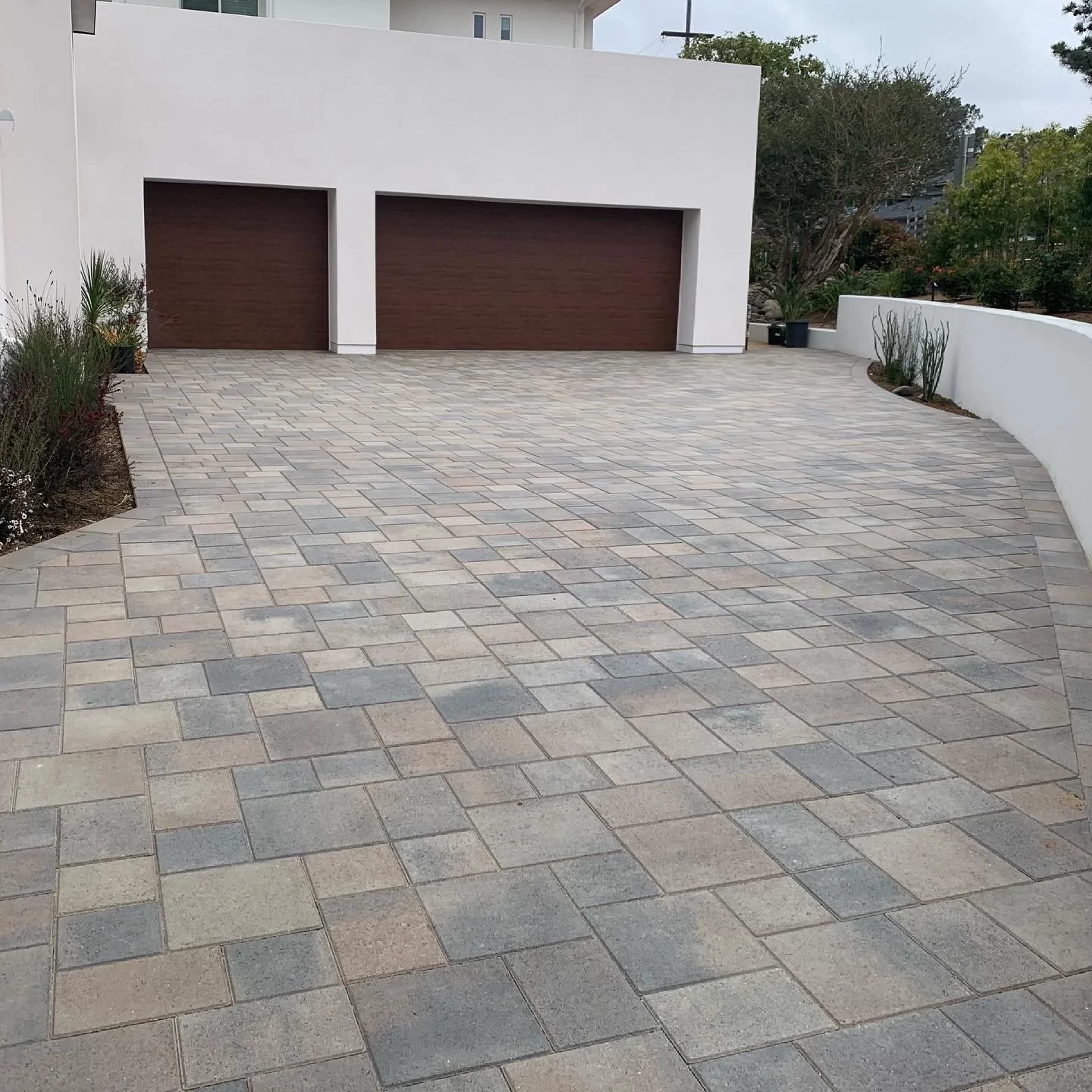 A modern residential paver driveway installation in La Jolla, CA