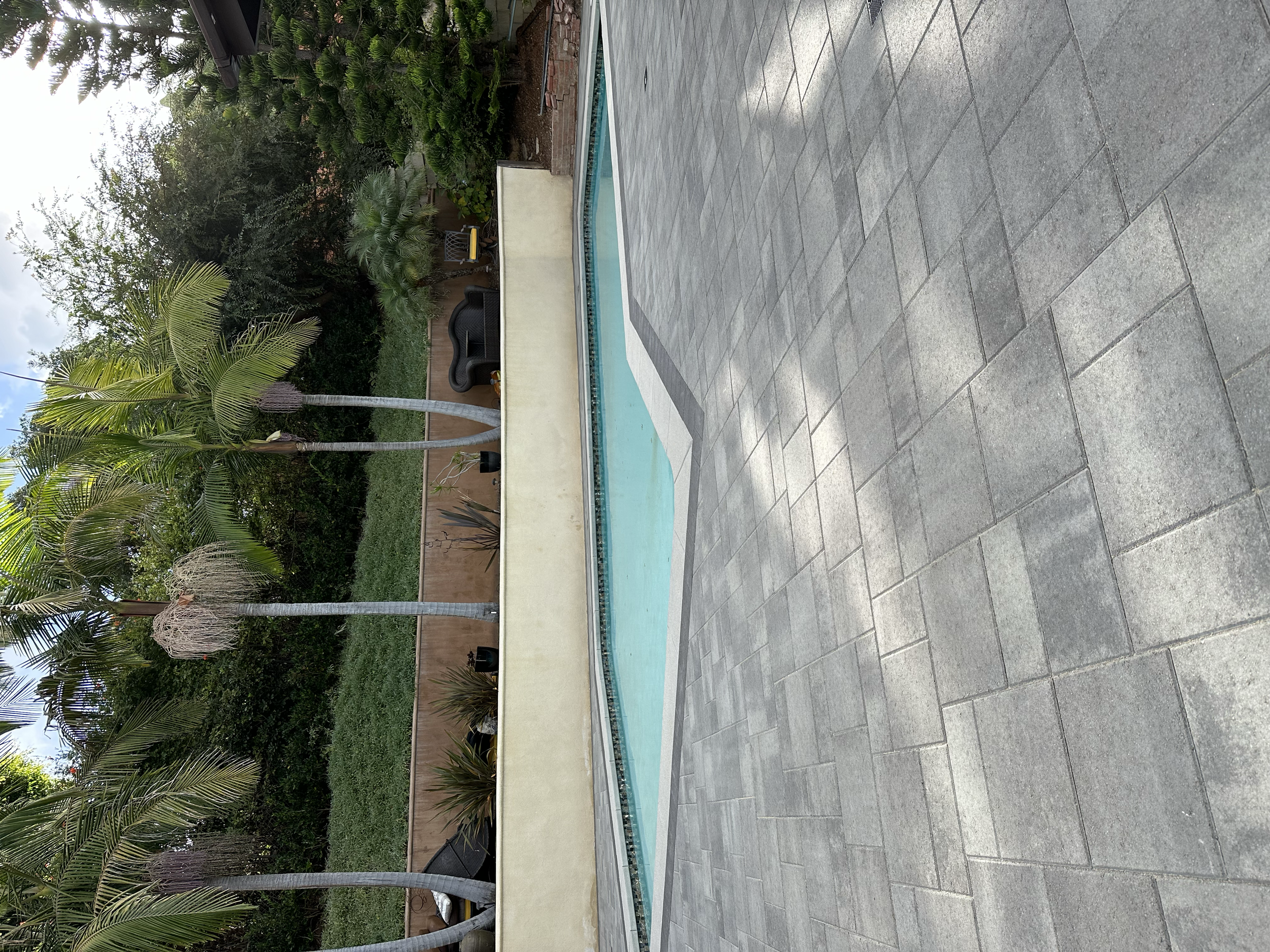 Custom paver pool deck and pool coping installation