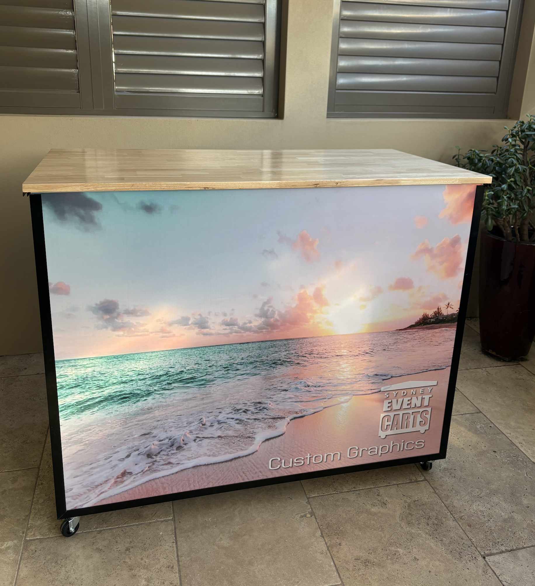 A portable pop up event cart with custom graphic insert