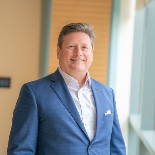 Chris Flaherty, founder of Revenue Strategy Partners, in a bright professional setting.