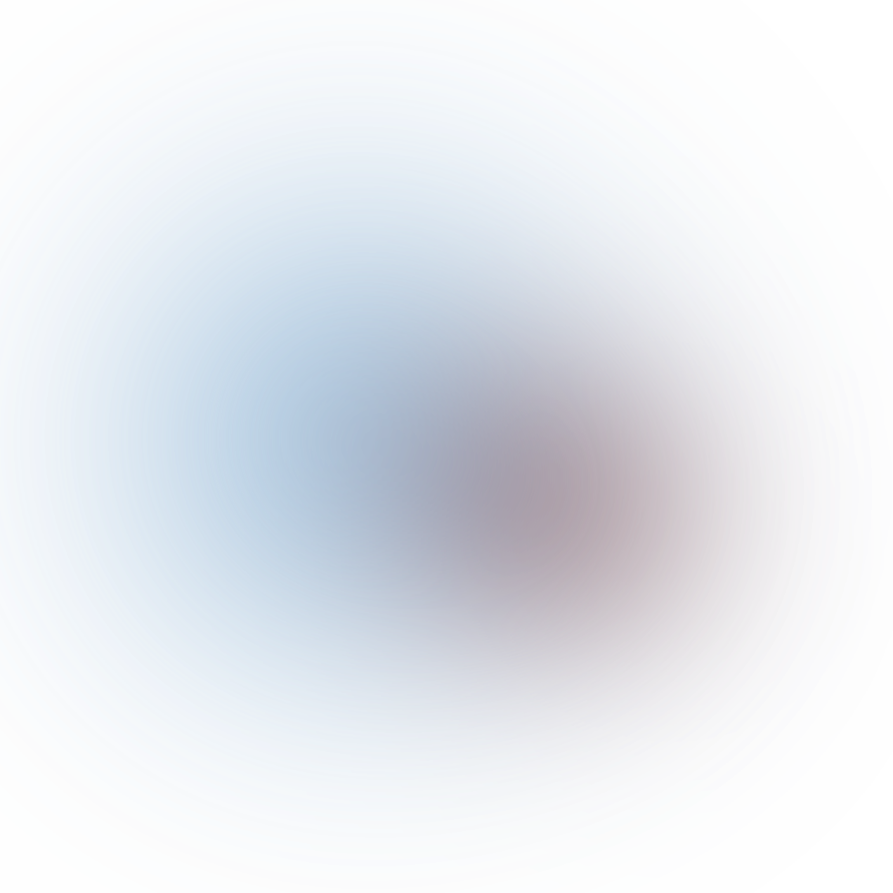 Blurred abstract colorful circular pattern with shades of blue, purple, and gray.