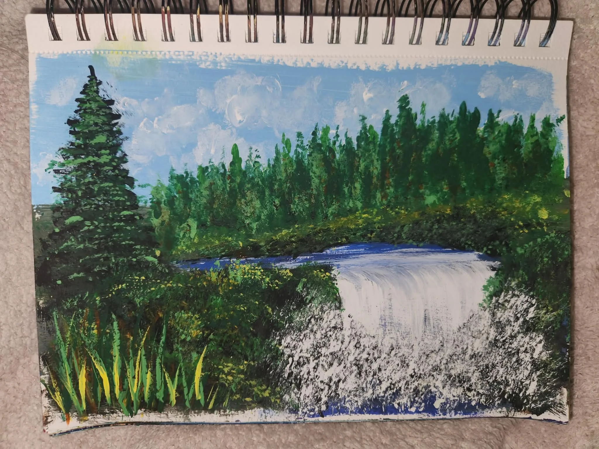 Original painting. A landscape painting of a forest scene with a blue sky, white clouds, green trees, and a small water body in the foreground.