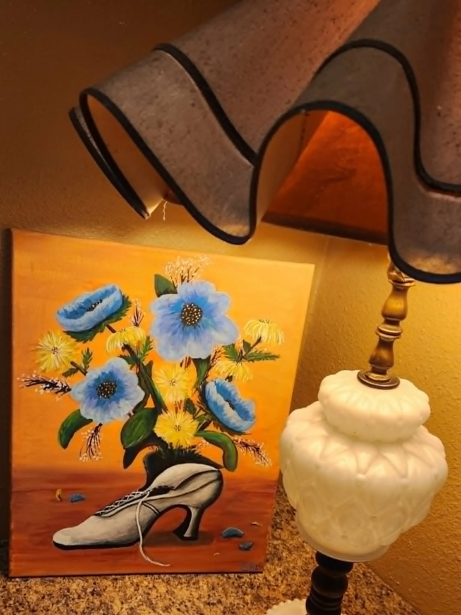 Original painting of blue and yellow flowers arranged in a high-heeled shoe.