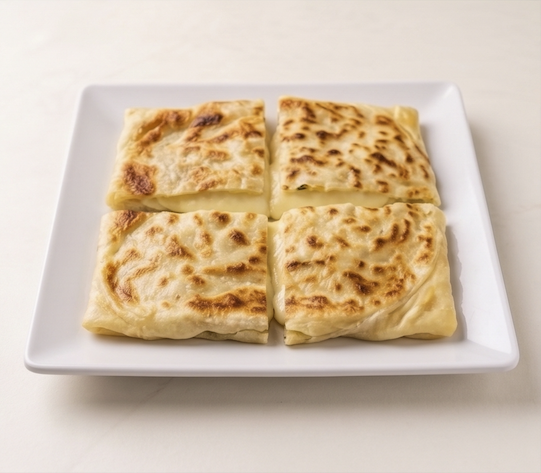 Cheese-filled savory pastry, cut into four pieces