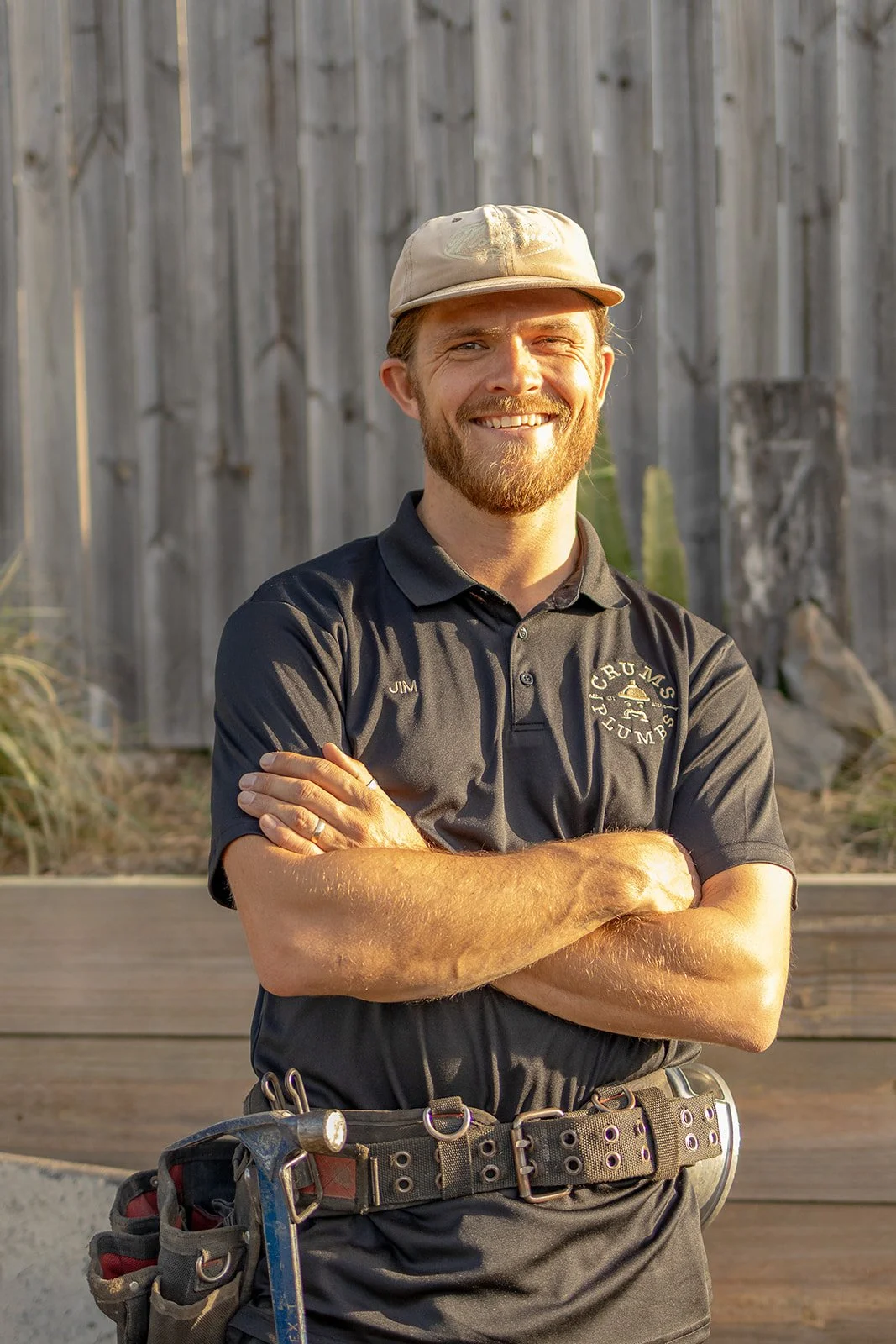 Jim Crum, local plumber and owner of Crums Plumbs, wearing his Crums Plumbs work shirt.