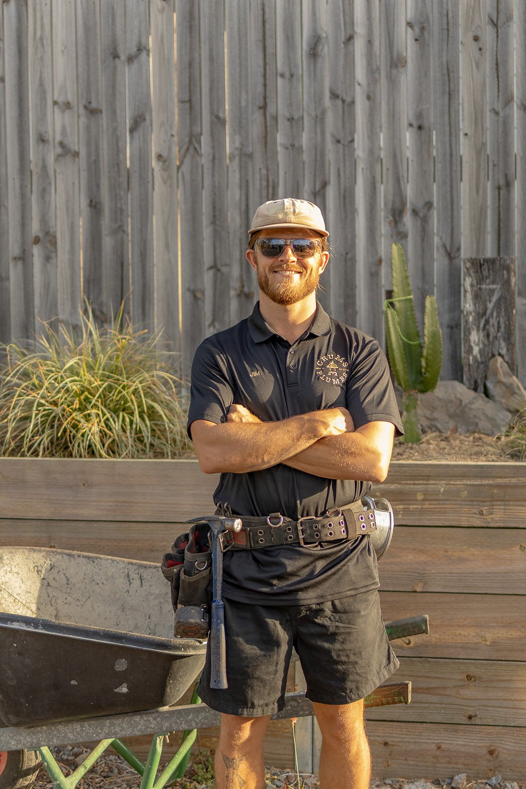 Jim Crum, local plumber and owner of Crums Plumbs, wearing his Crums Plumbs work shirt.
