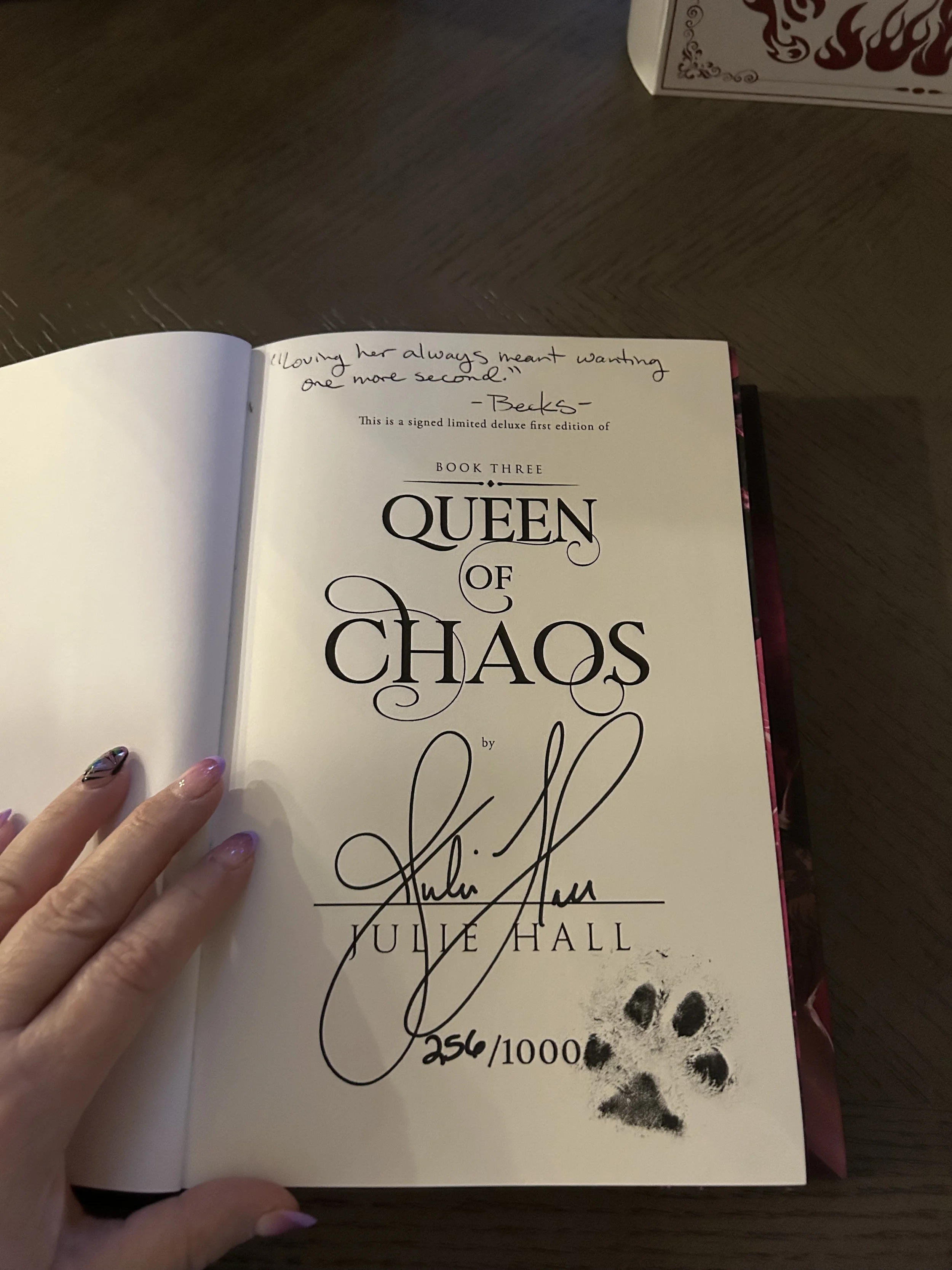 Queen of Chaos title page signed by author Julie Hall and hand-numbered 256 out of 1.000 copies.