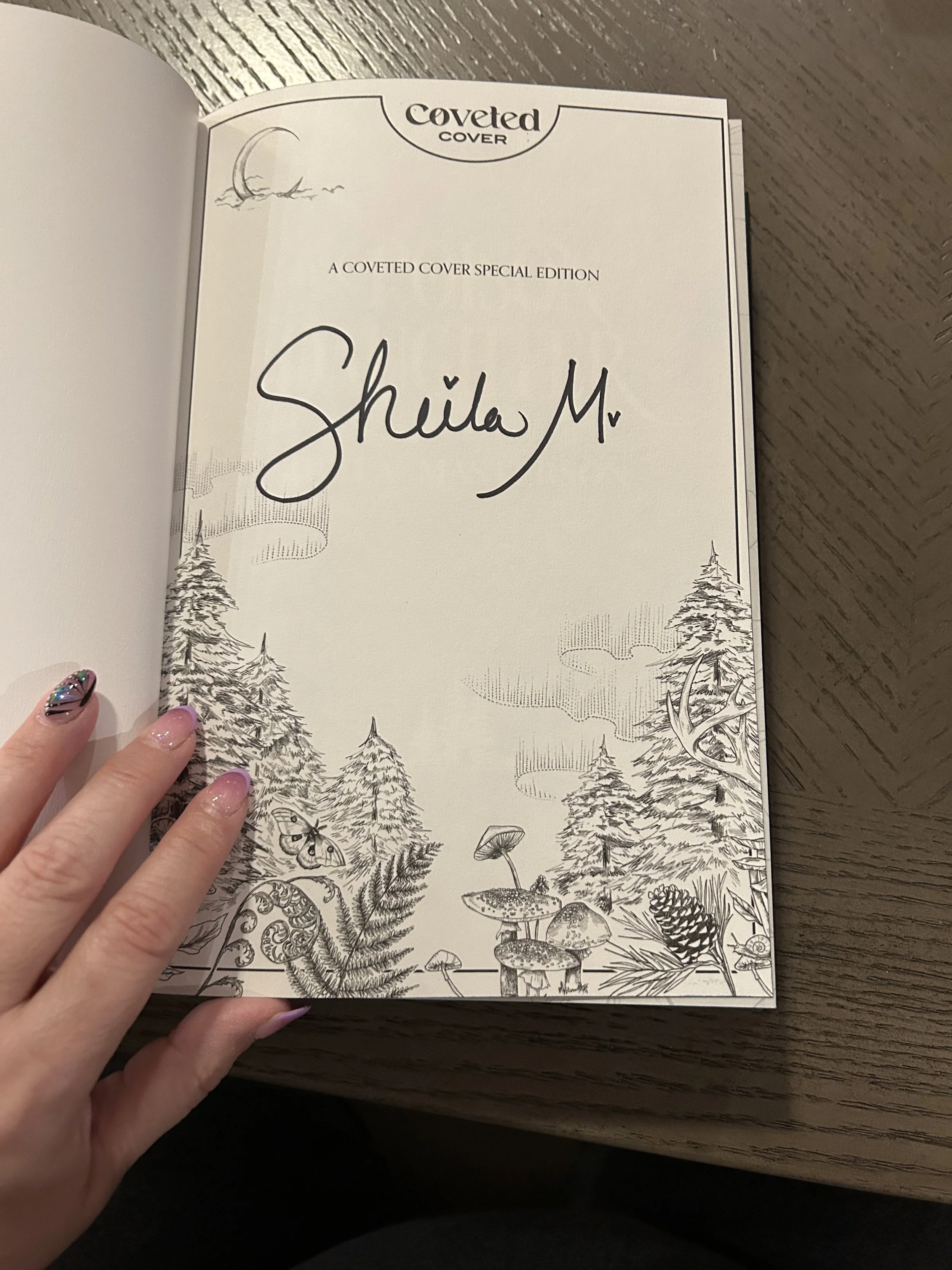 The signed page gives the Coveted Cover edition one more true collector's edition detail.