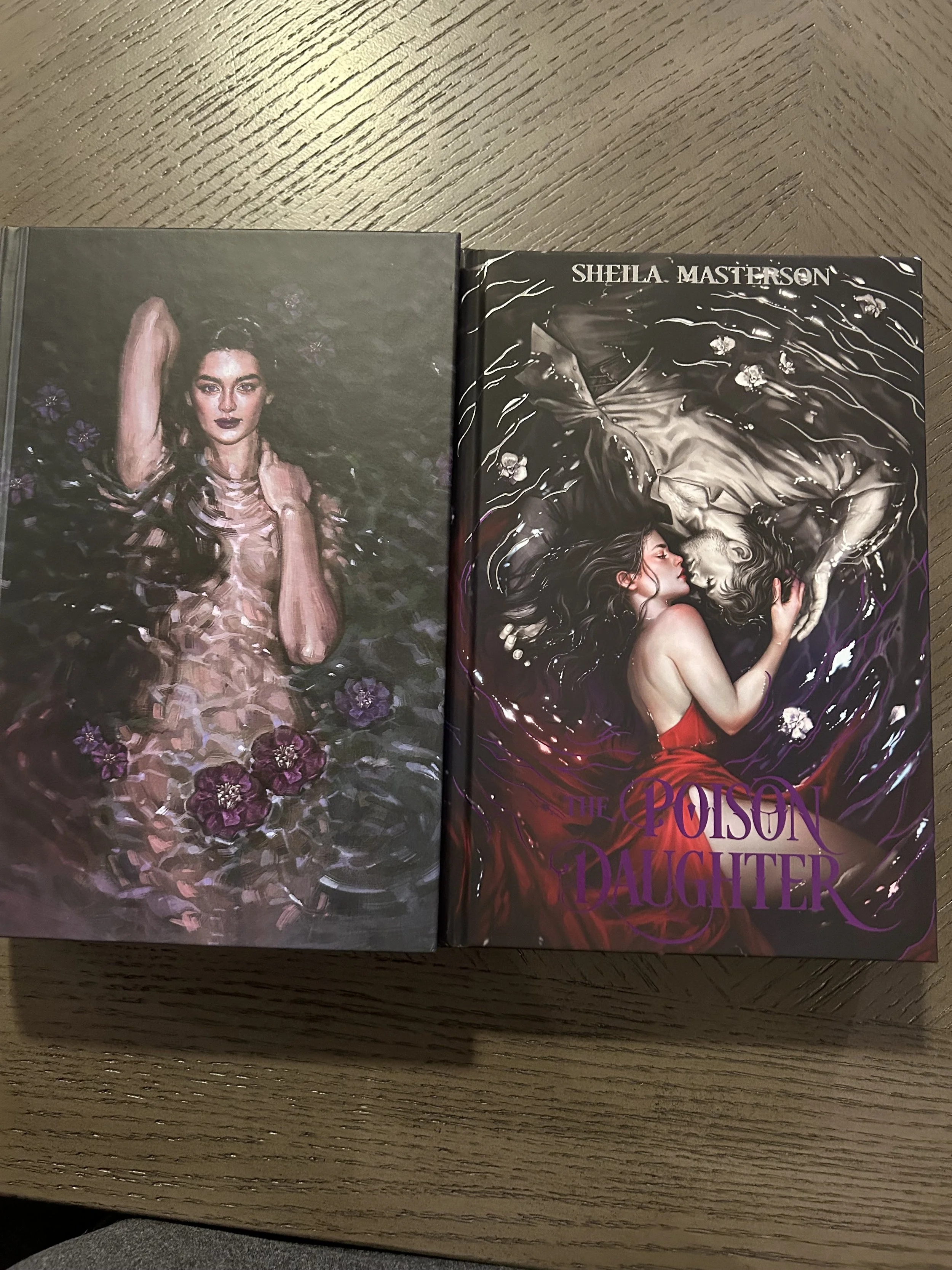 Two case-bound editions of The Poison Daughter side by side: the retail hardcover showing Harlow surrounded by dark water and flowers, and the Coveted Cover edition showing Harlow in red reaching toward a pale figure beneath the water.