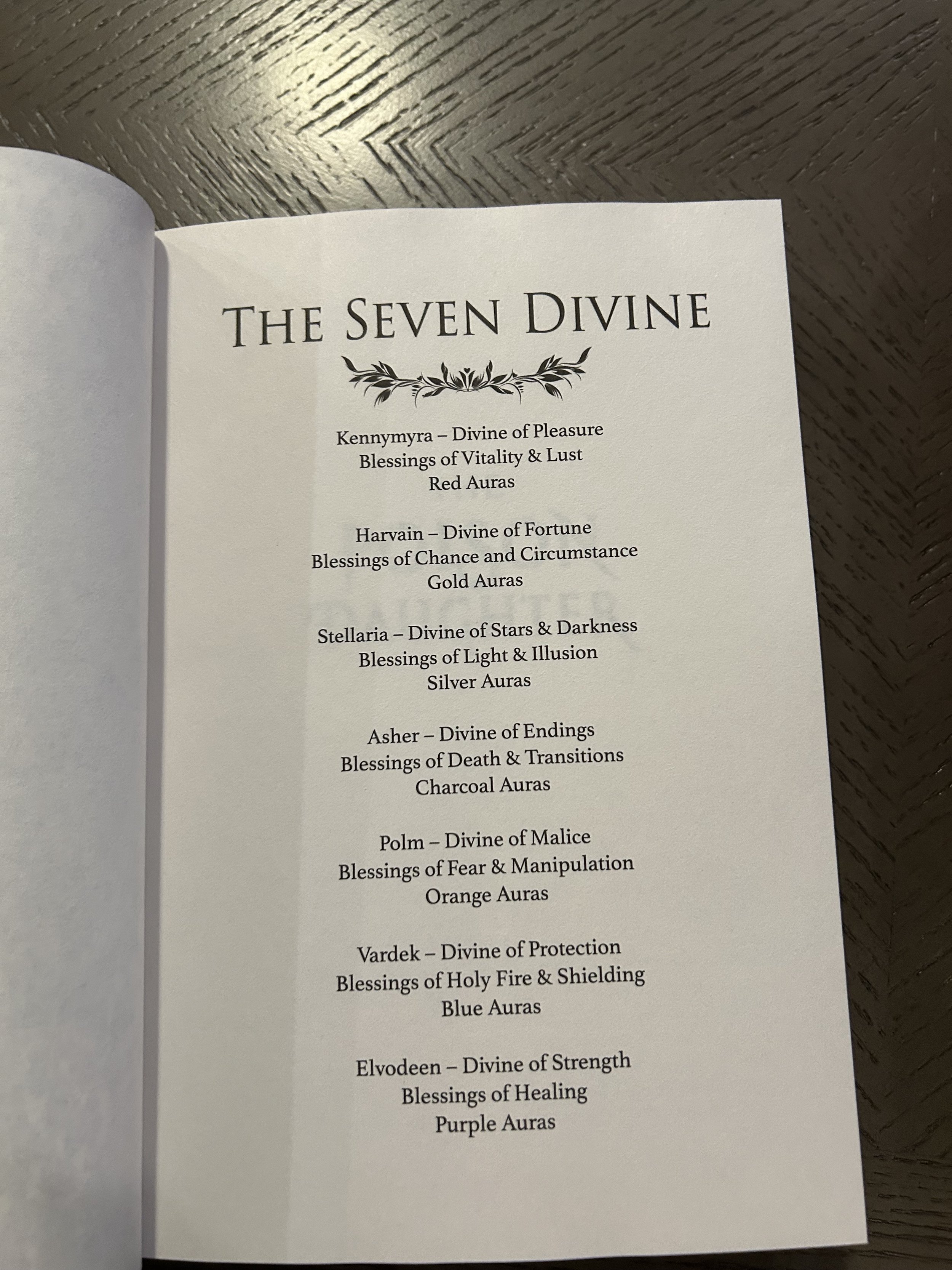 Reference page titled The Seven Divine listing seven deities, their powers and their corresponding aura colors.