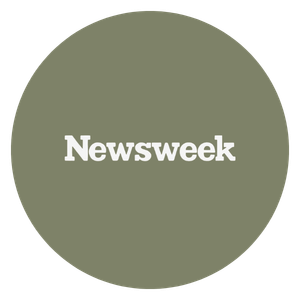 A circular logo with a grayish-green background and the word 'Newsweek' in white text at the center.