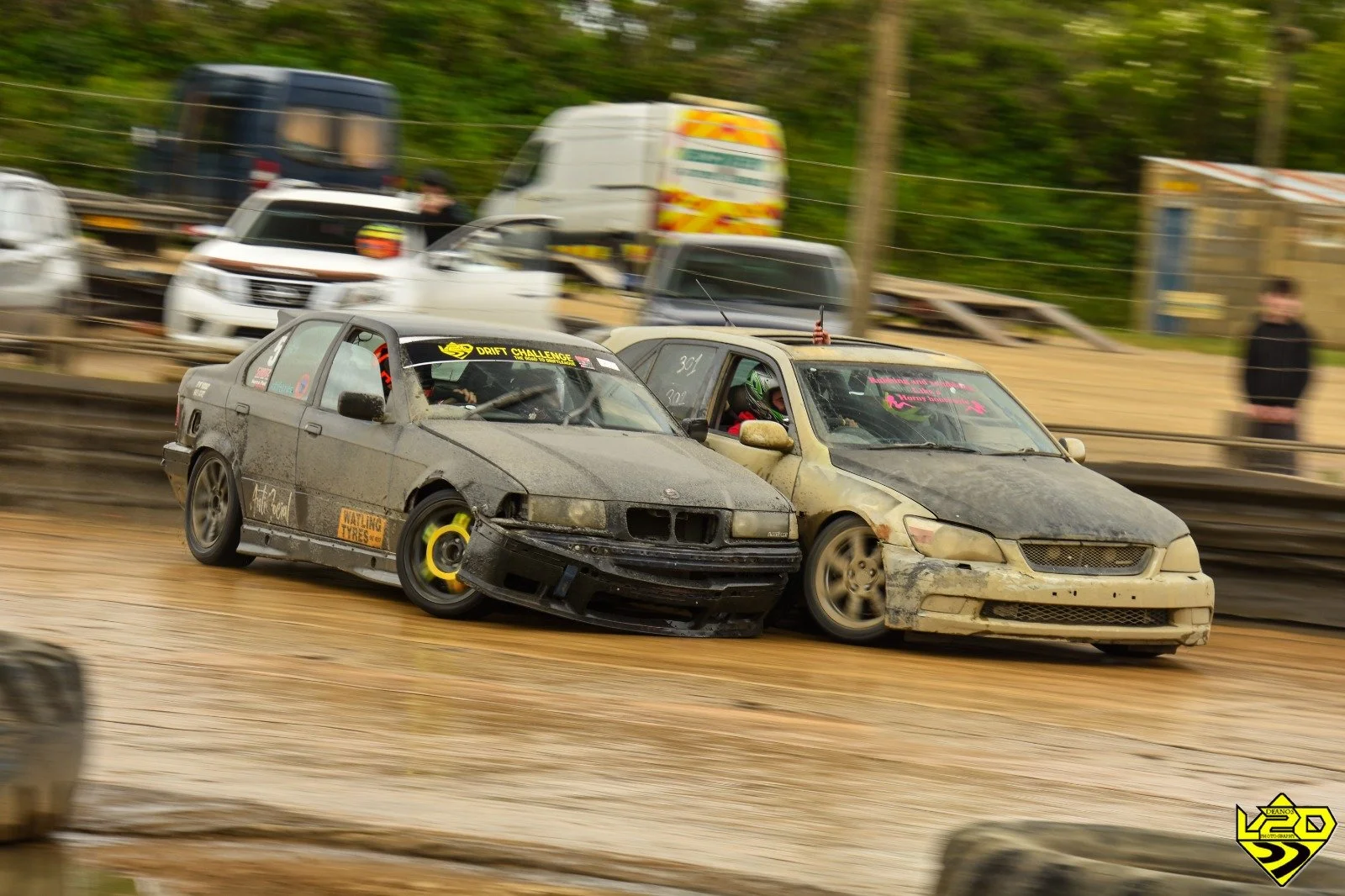 Two drift cars getting impressively  close during a drift on track