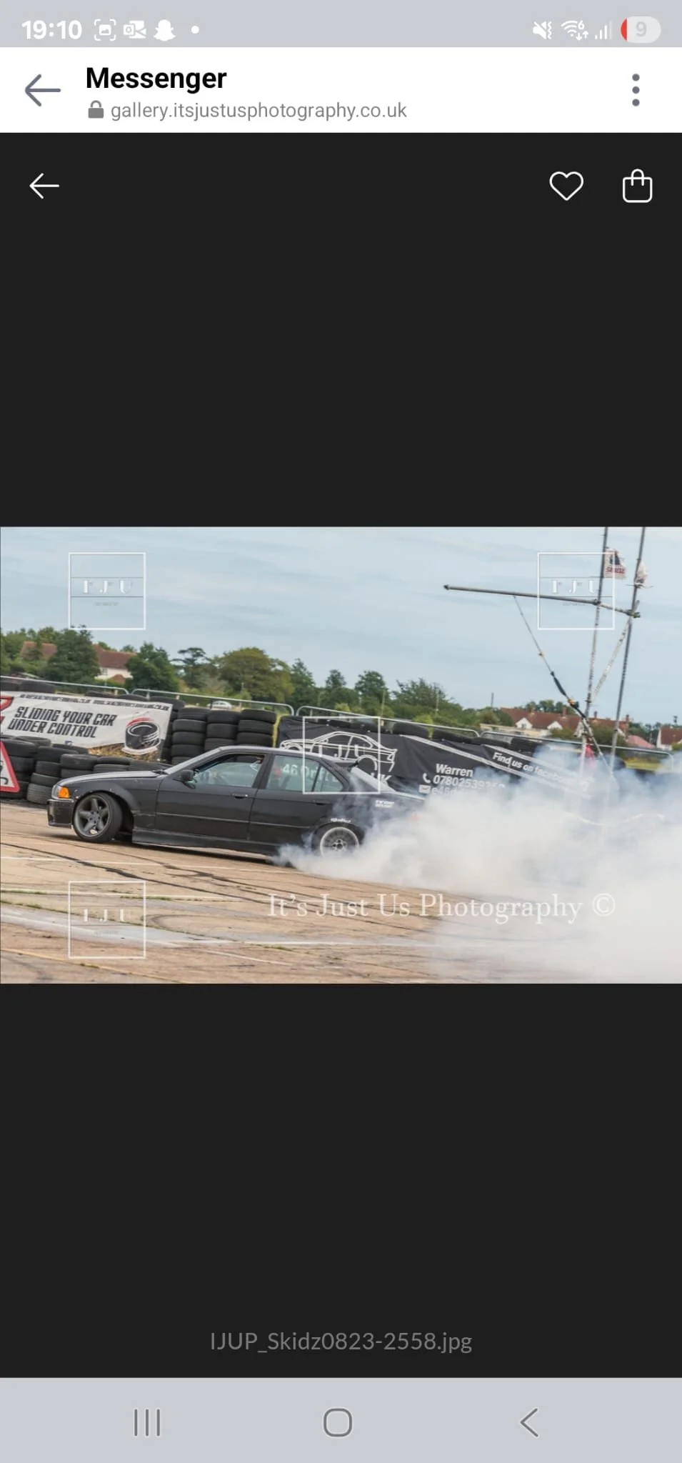 A black drift car making smoke from the tyres on a drift day 