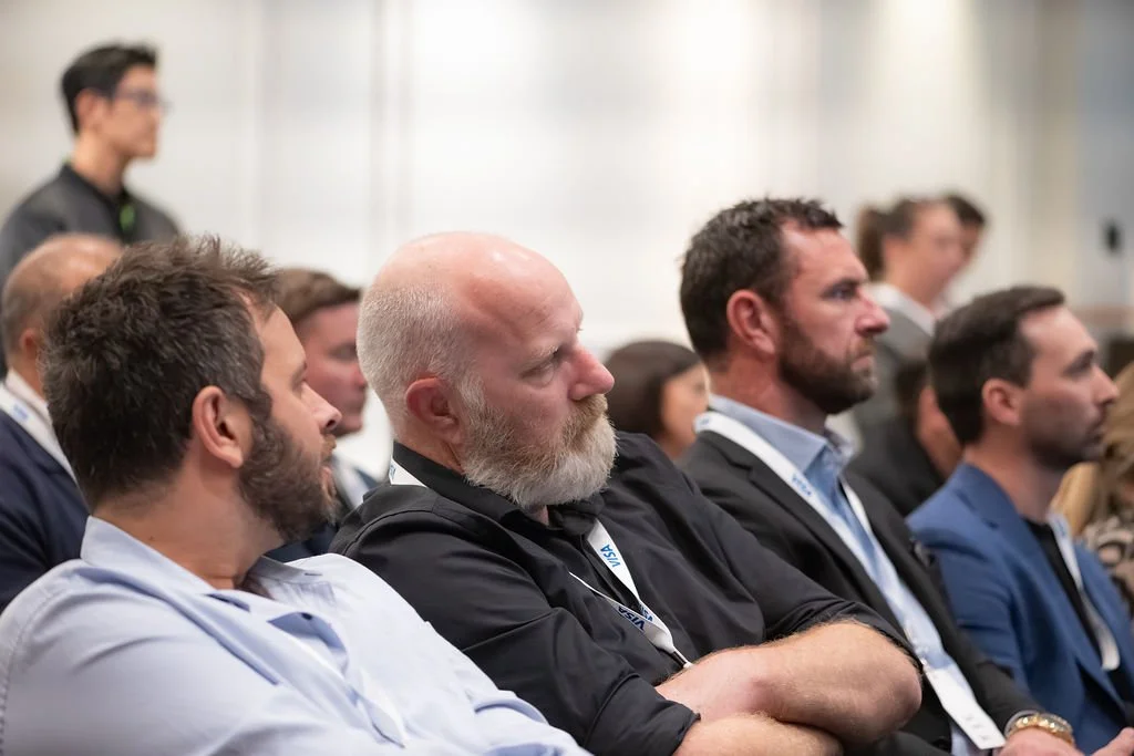 Audience attentively listening during a conference or seminar.