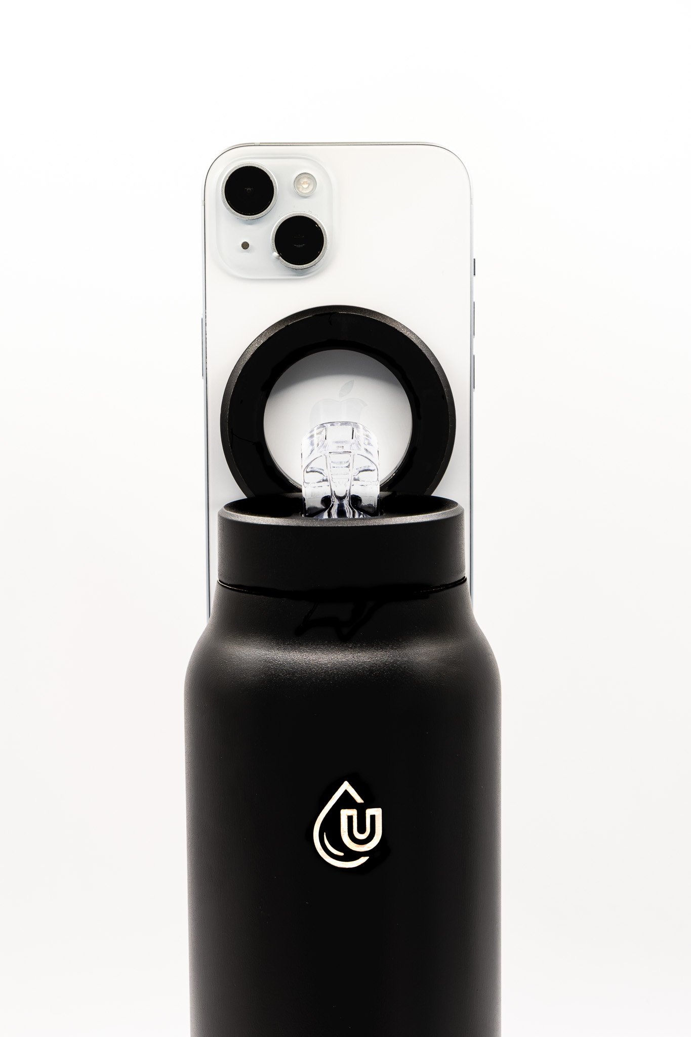 A close-up image of a black-and-white portable vaporizer with a water drop icon and power symbol printed on it, placed in a black holder against a plain white background.