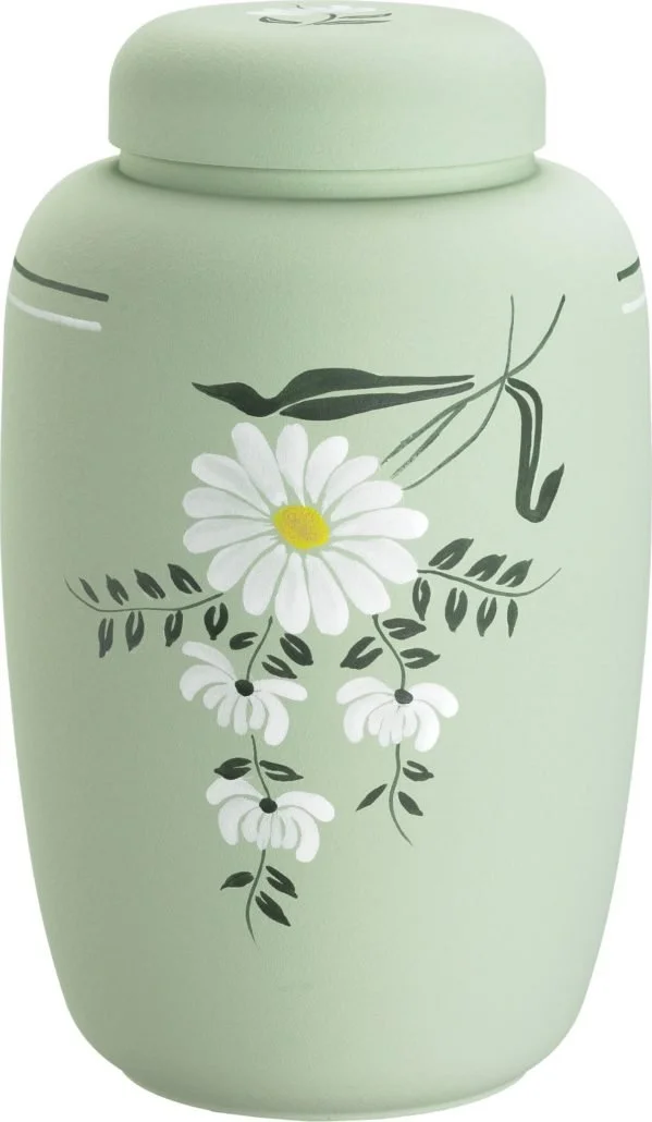 Holdbar, lys grønn urne med hvite blomster og grønne blader malt på utsiden.