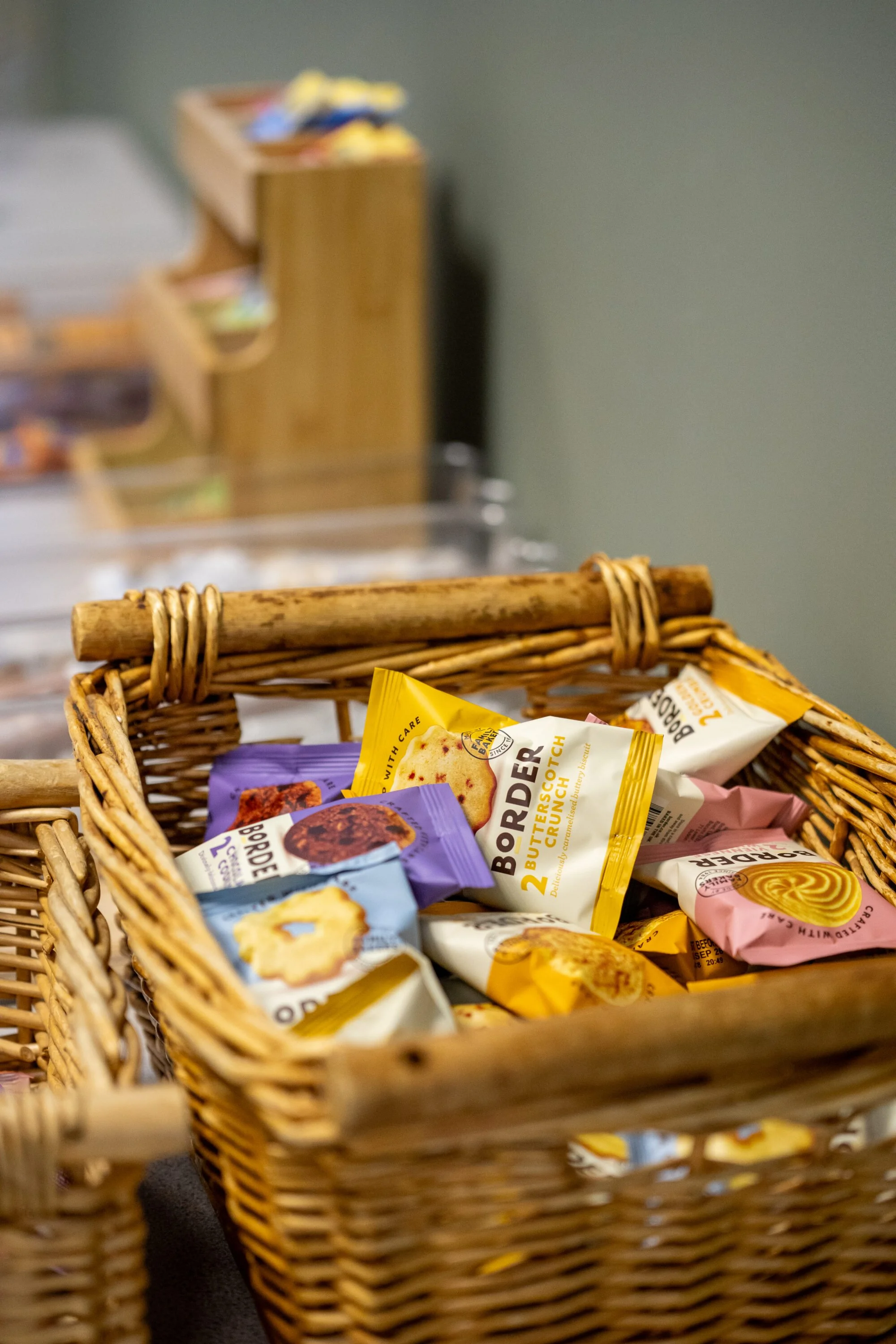 A close-up view of a wicker basket filled with assorted biscuits from our catering selection.