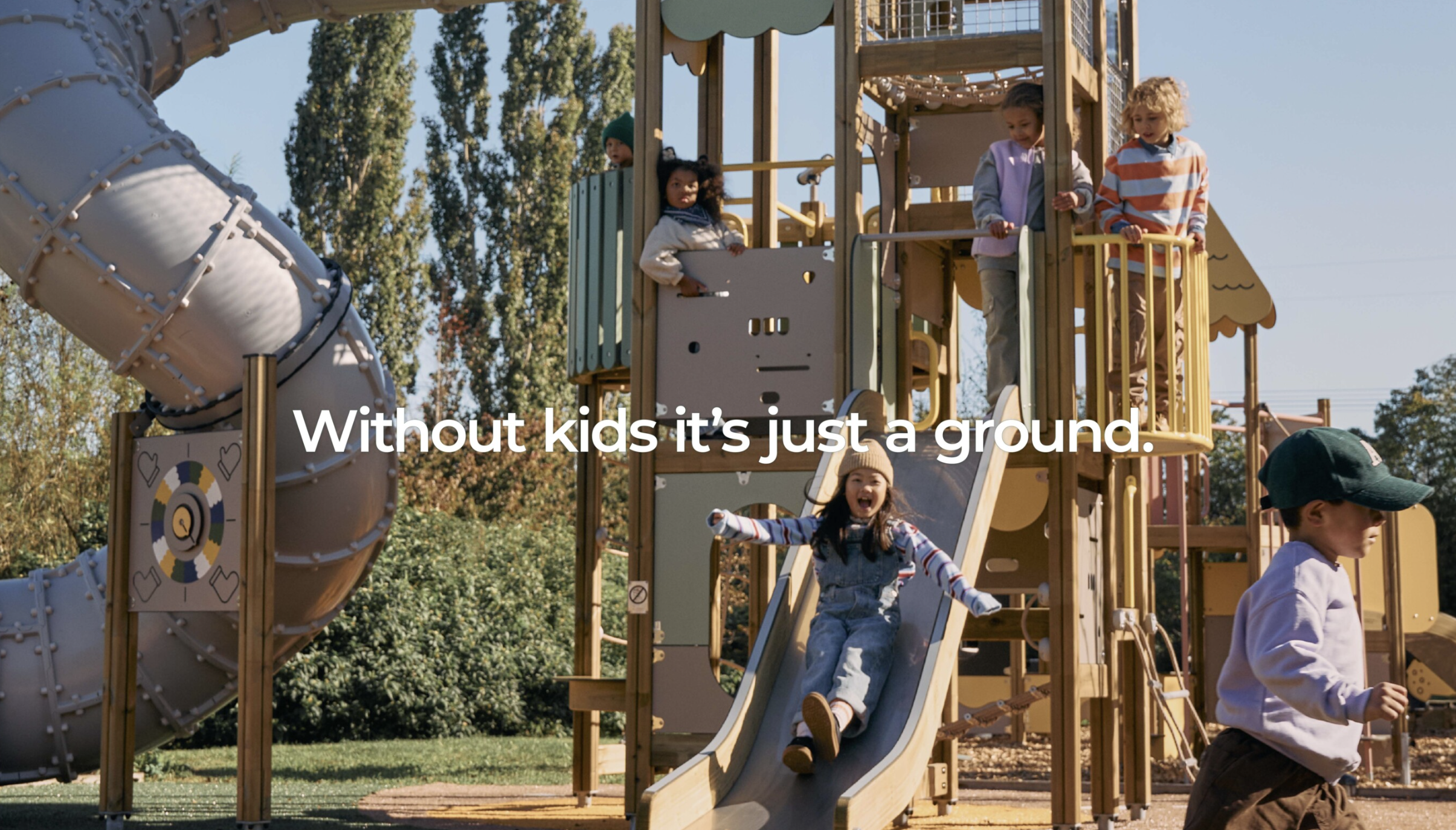 Children playing on Lappset playground. Ad photo for Lappset Prime playgrounds.  the text 'Without kids it's just a ground.'