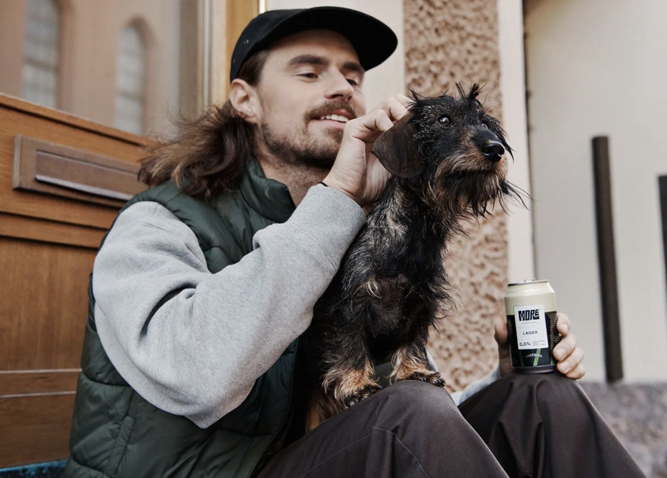 man with dog smiling. brand photo
