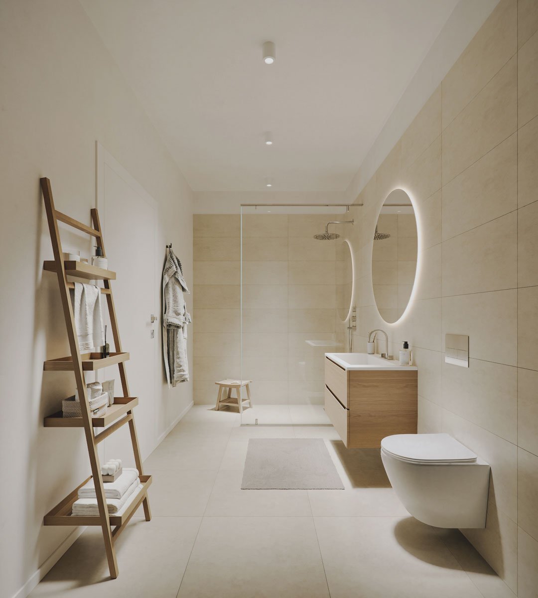 Bagno moderno con pareti e pavimenti chiari, doppi specchi rotondi illuminati, lavabo in legno con mobiletto bianco, toilette sospesa, doccia con parete in vetro, scaffale in legno con asciugamani, tenda e sgabello in legno, tappetino grigio, e luci 