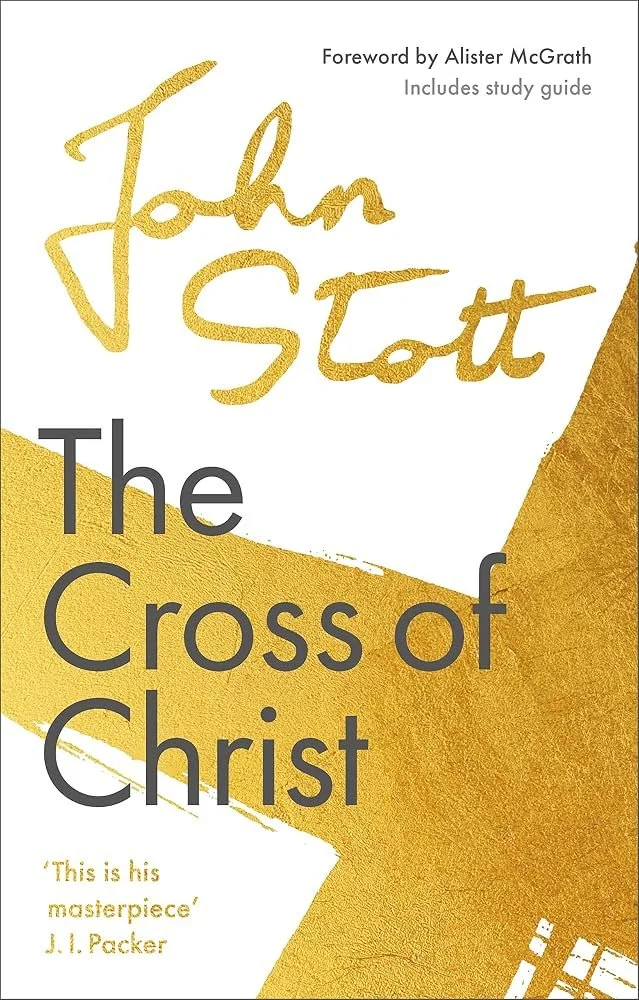 Book cover of 'The Cross of Christ' by John Stott, with a gold and white abstract background and a quote by J.I. Packer at the bottom.