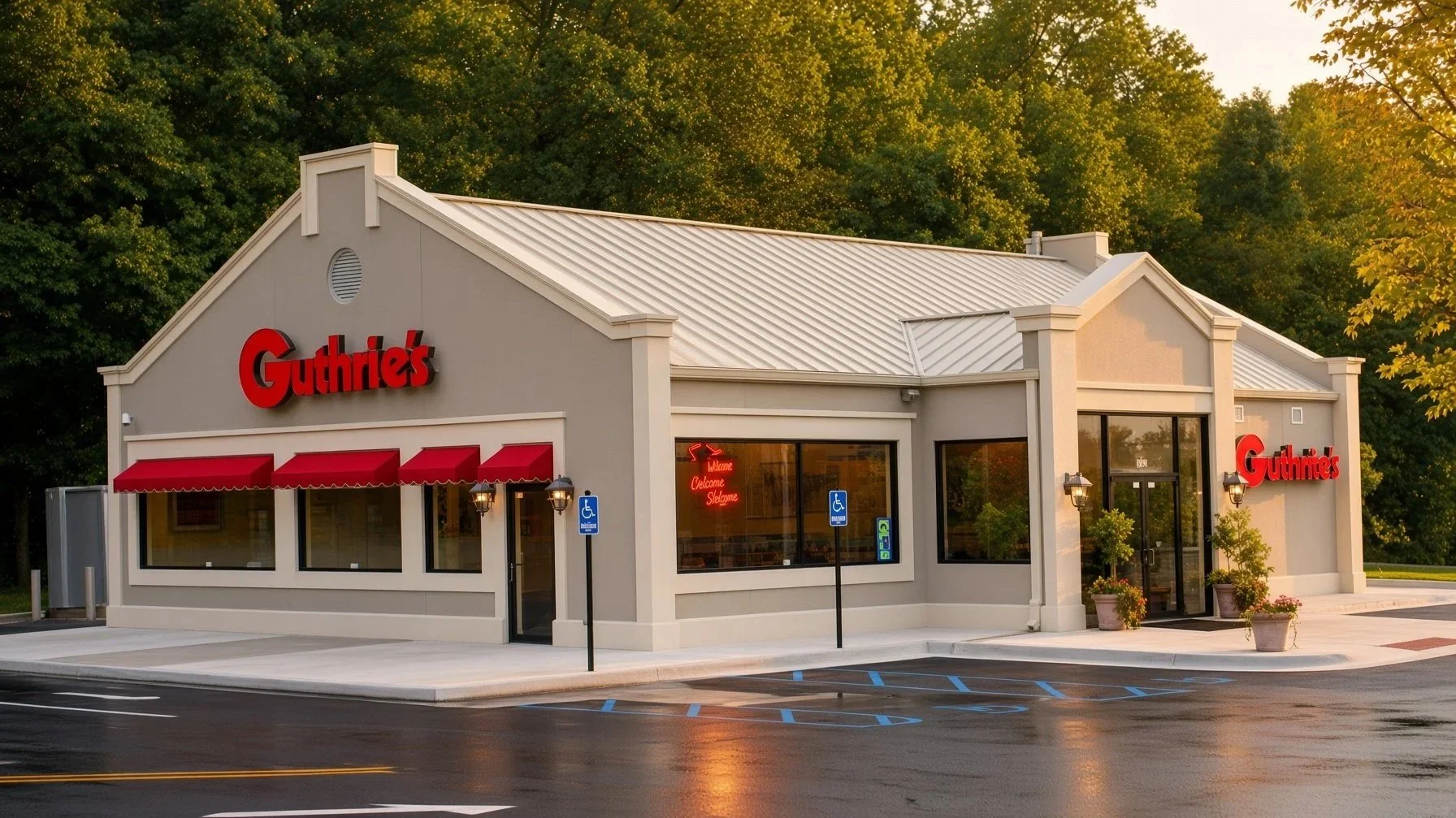 Exterior of a Guthrie's restaurant with gray walls, red signage, red awnings, and large windows, set against a backdrop of green trees at sunset.