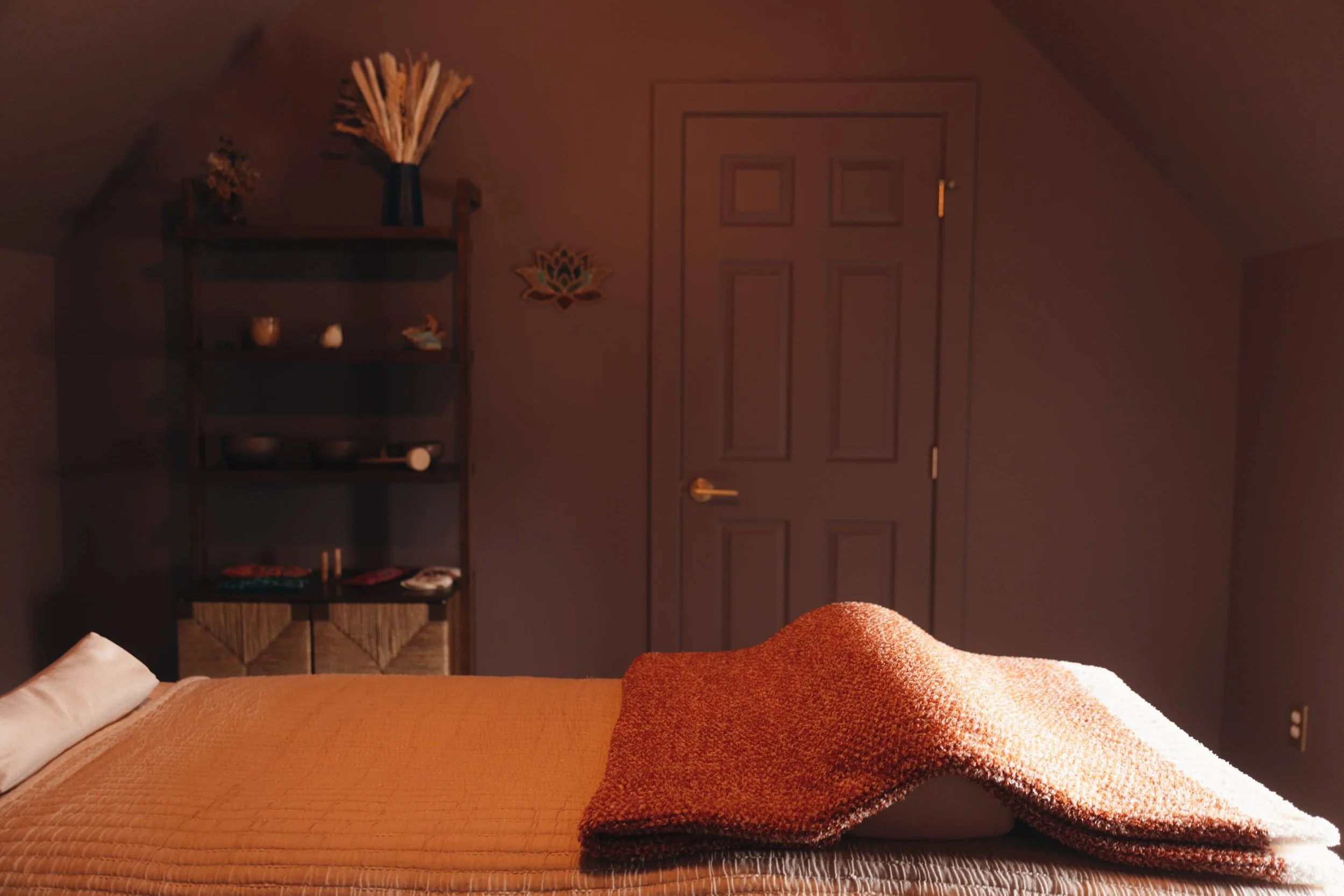 The inside of the studio with a folded orange blanket