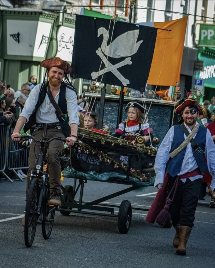 Carnival float created by artist Phil McSweeney, featuring handcrafted sculptural elements made from natural materials