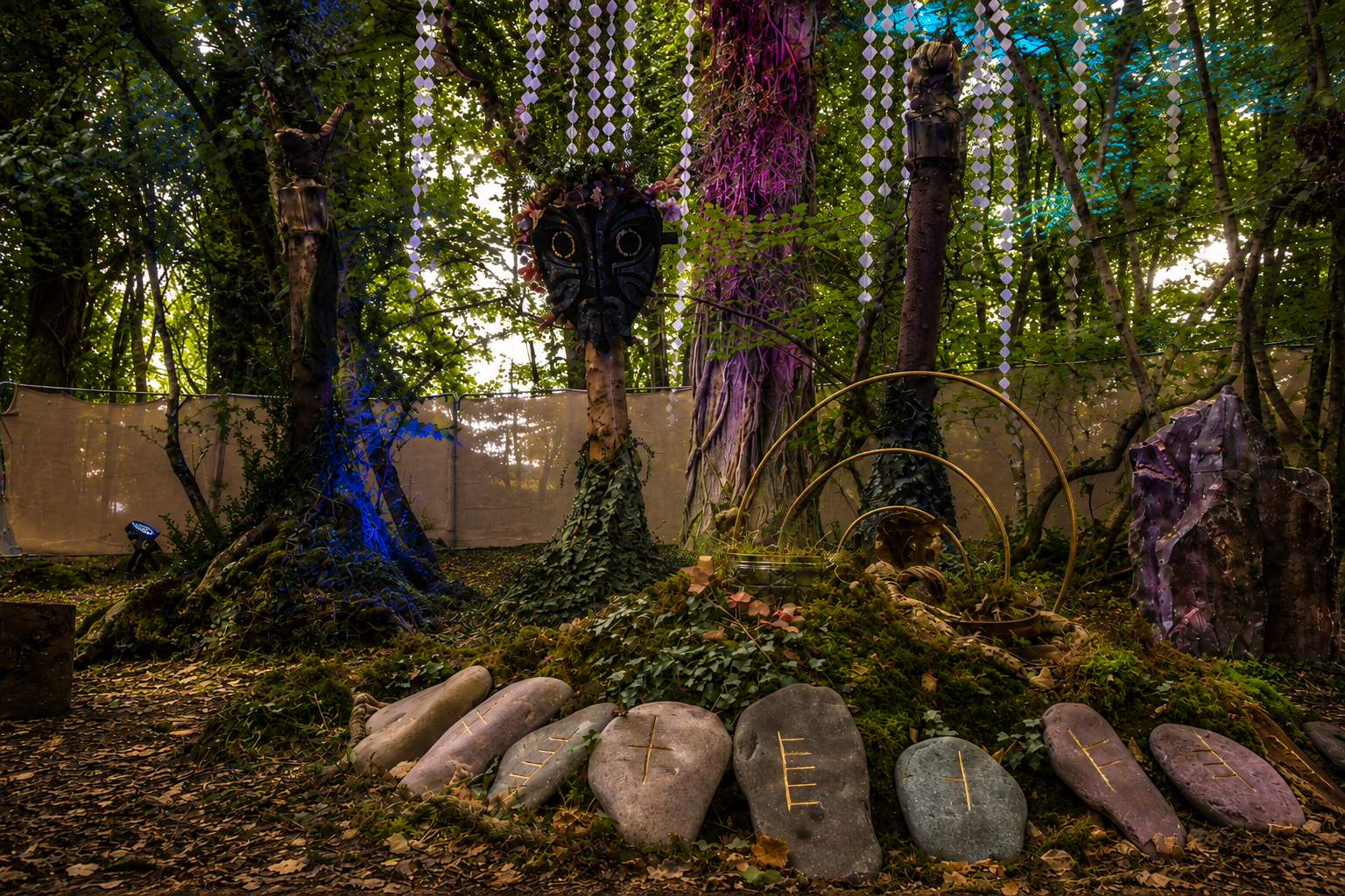 Electric picnic  Festival Art trail installation featuring Cernunnos and three stag guardians, created from natural materials and surrounded by wild planting