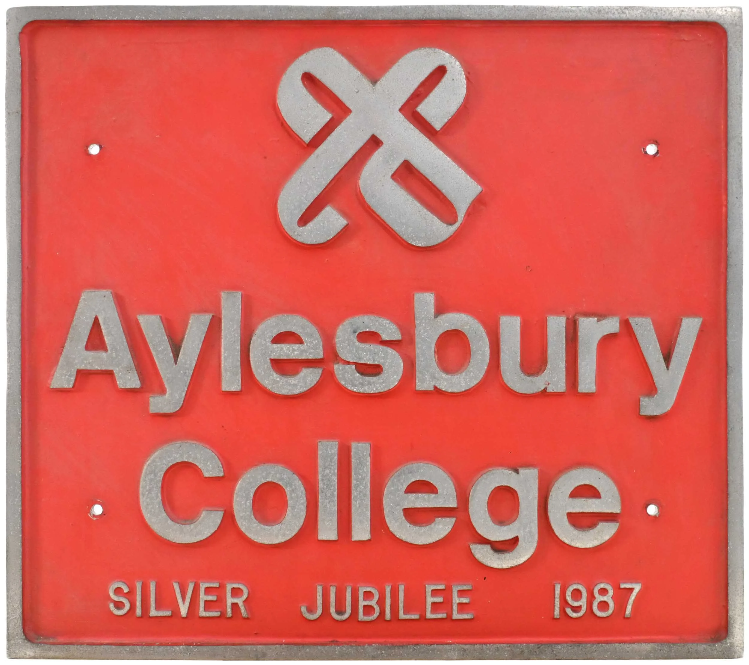 locomotive nameplate with the word "Aversky" in metal letters and a heart-shaped symbol above it. The plaque has the words "Silver Jubilee 1987" at the bottom.