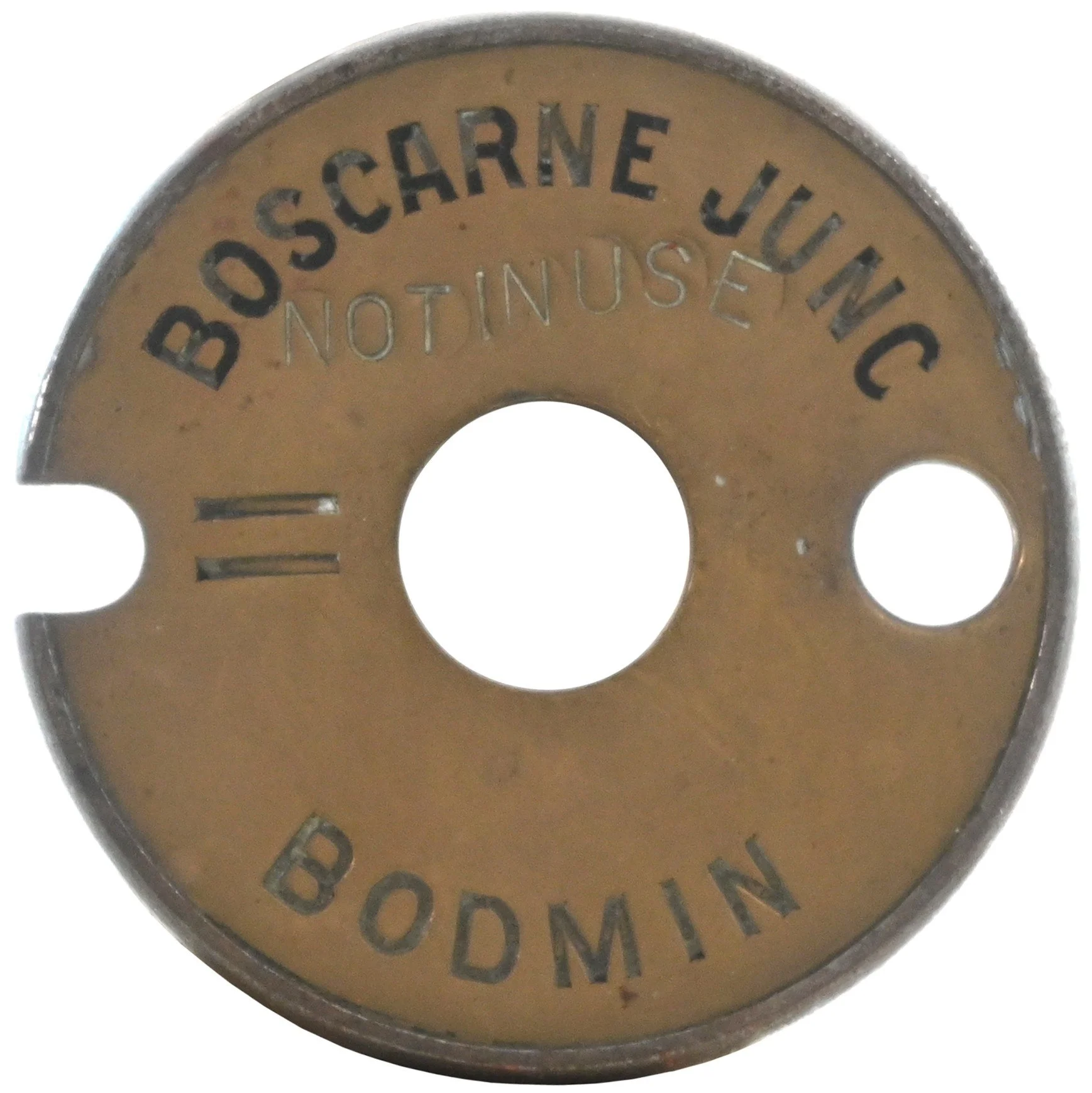 Close-up of a single line tablet with engraved text reading "BOHEMIA JIU JITSU NOT IN USE" in a circular pattern.