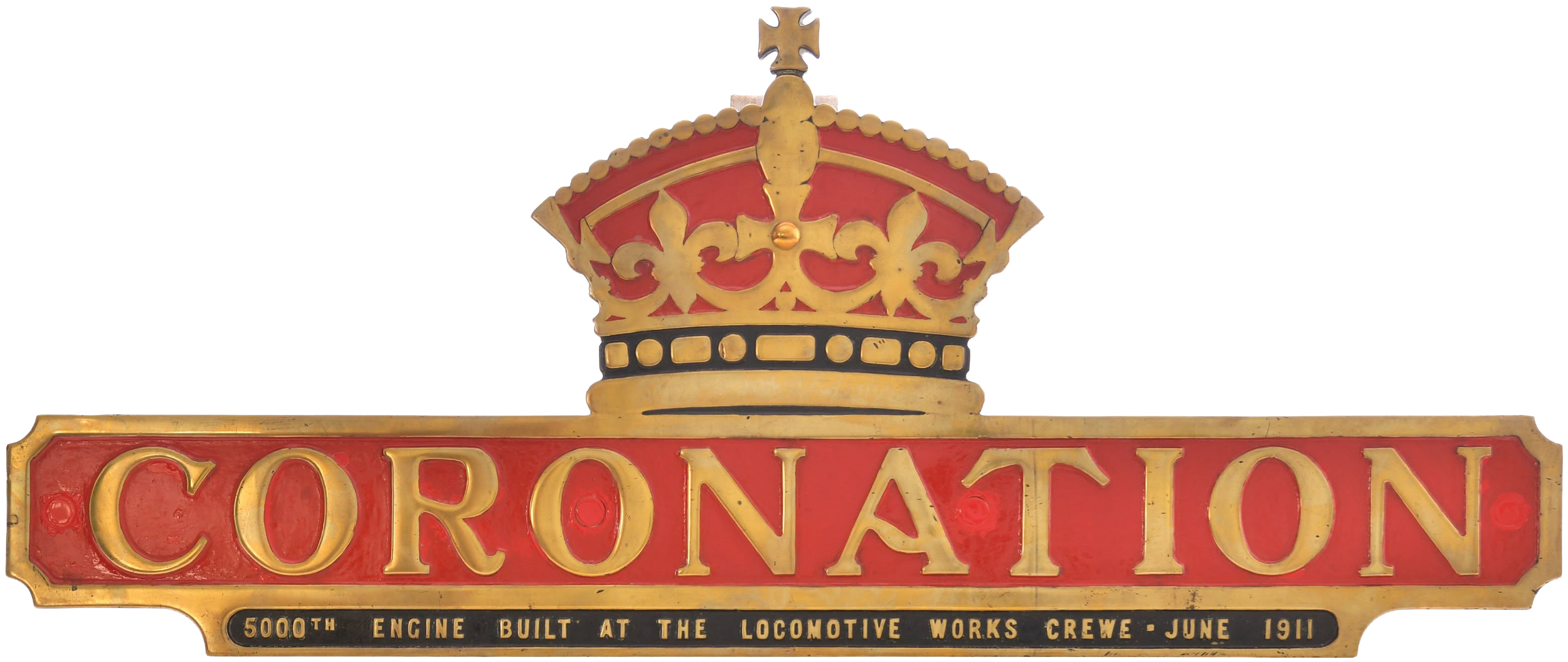 A vintage sign with a gold and red crown on top, reading 'CORONATION'. The sign commemorates the 5000th engine built at the locomotive works crew in June 1911.