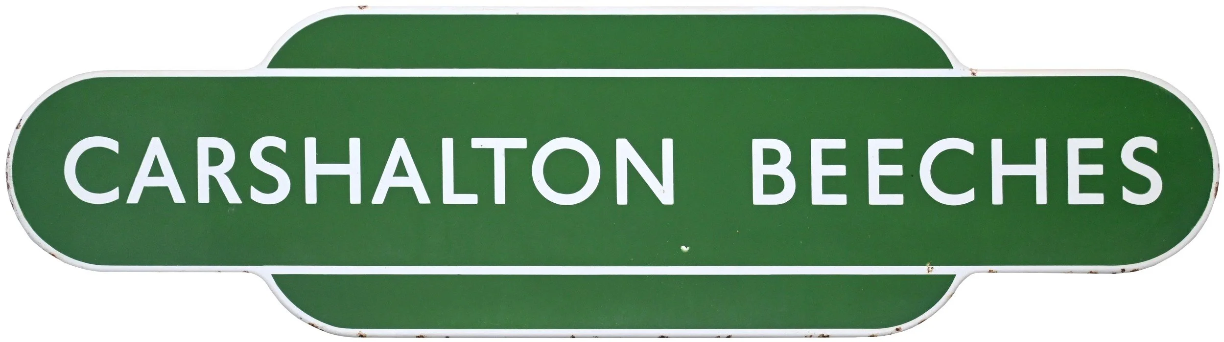 Green railway station Totemsign with white text reading 'Carshaton Beeches'
