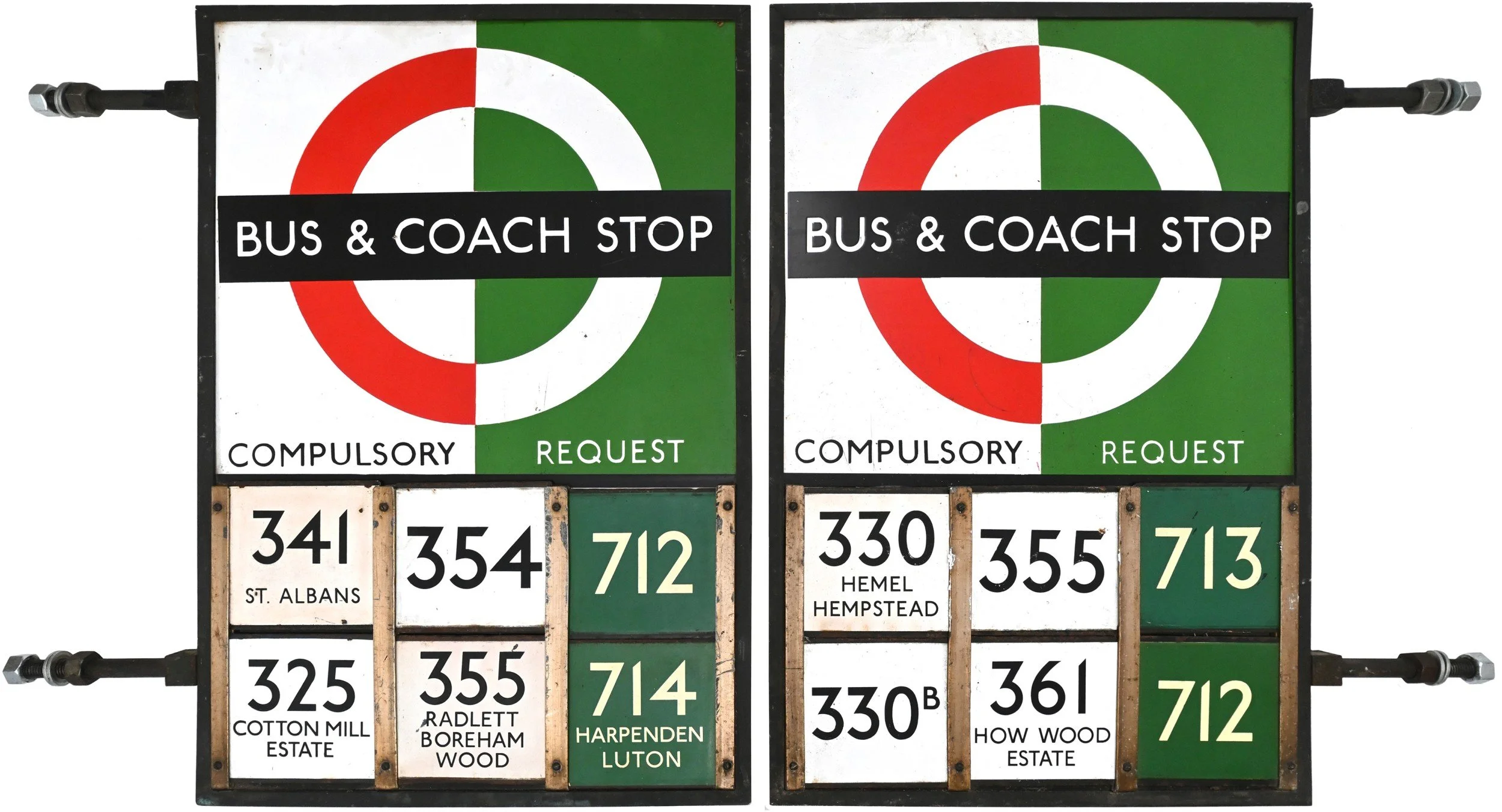 Two bus and coach stop signs with schedules attached below. The signs feature a circular logo with red, white, and green sections and the words 'BUS & COACH STOP' and 'COMPULSORY REQUEST' on a black band.