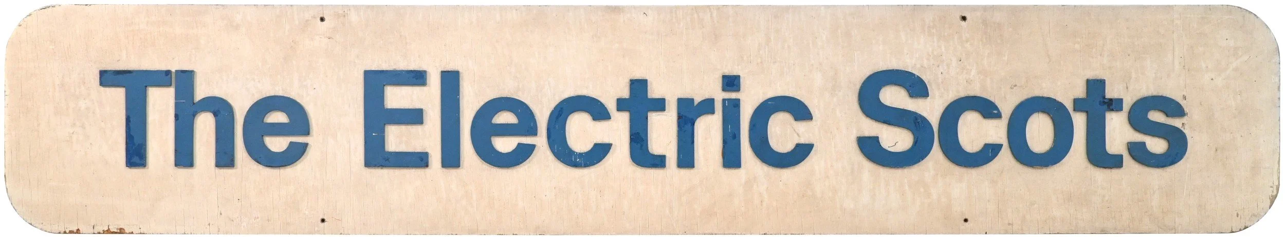 A sign with the text 'The Electric Scots' in blue letters on a light background.