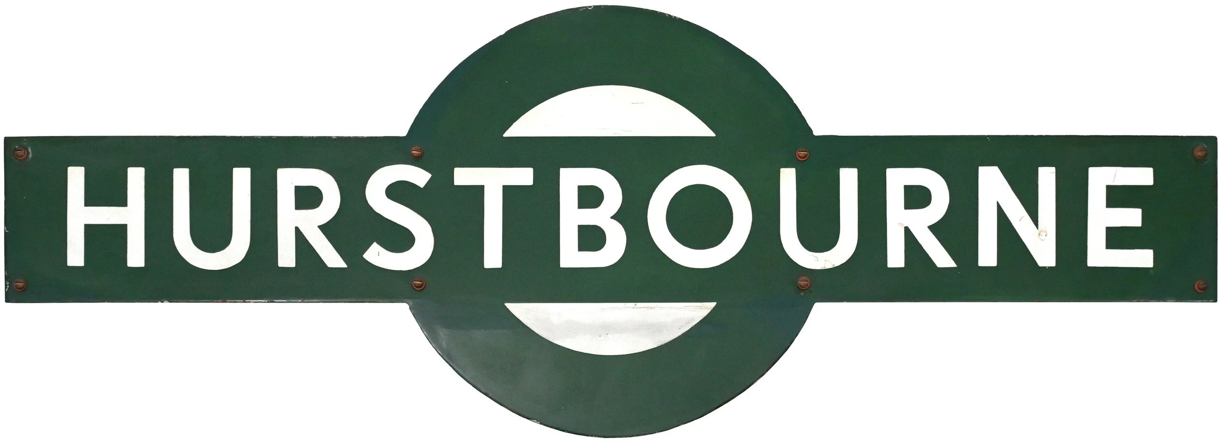Green railway station Target sign reading 'Hurstbourne' with a circular green and white design element behind the text.