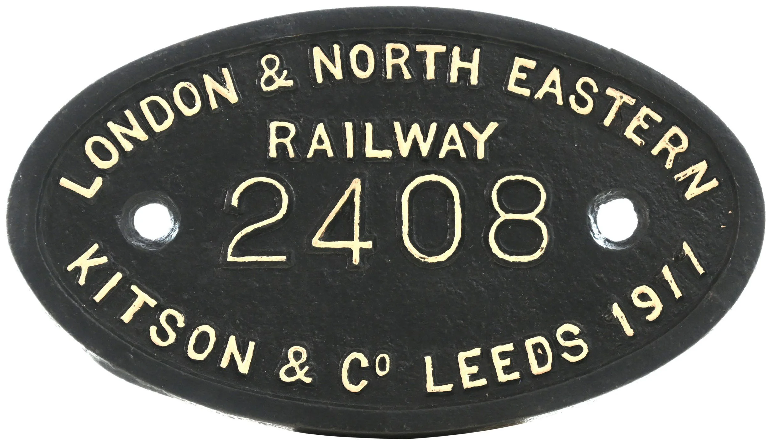Vintage railway locomotive plate with black background and white embossed text reading 'LONDON & NORTH EASTERN RAILWAY 2408 KITSOL & CO., LEEDS 1919'.