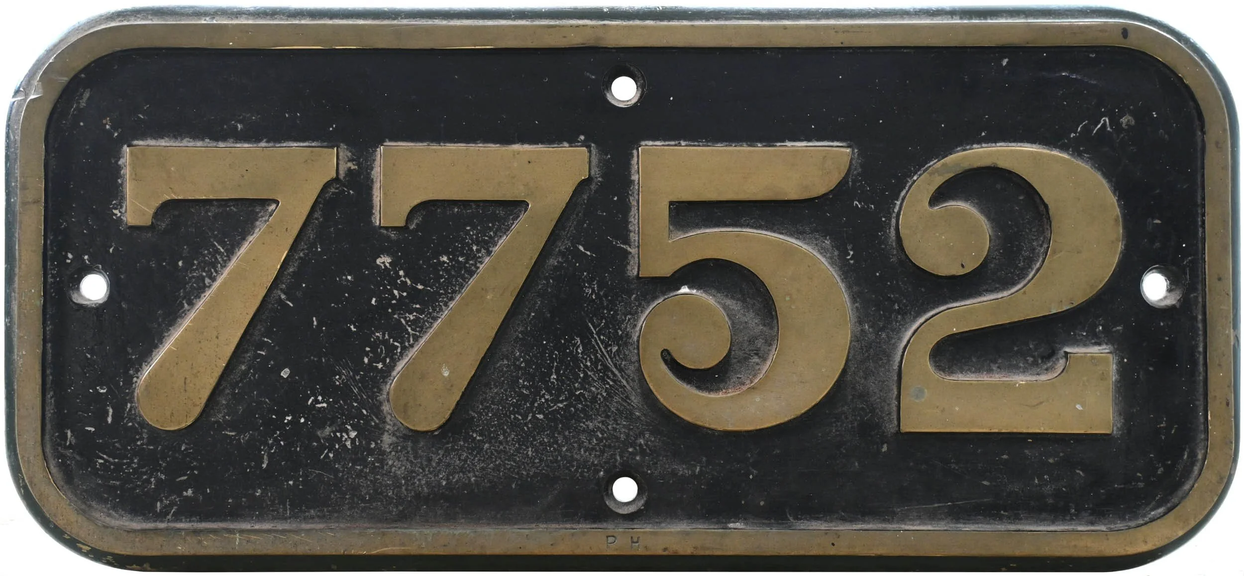 GWR Cabside numberplate 7752 in brass on a black background.