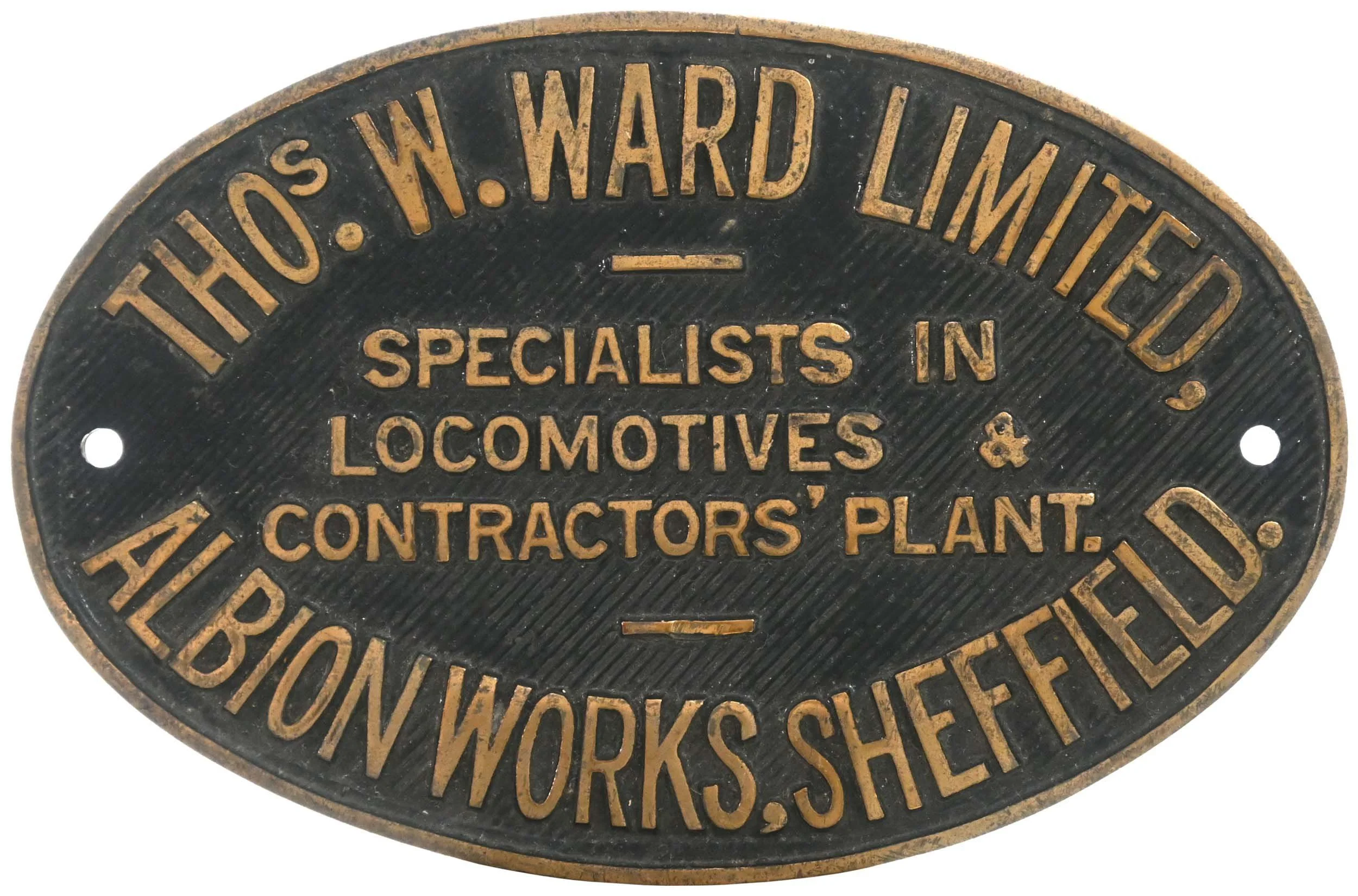 An oval black and gold plaque with embossed text that reads, 'Thos. W. Ward Limited - Specialists in Locomotives & Contractors' Plant - Working Class'.